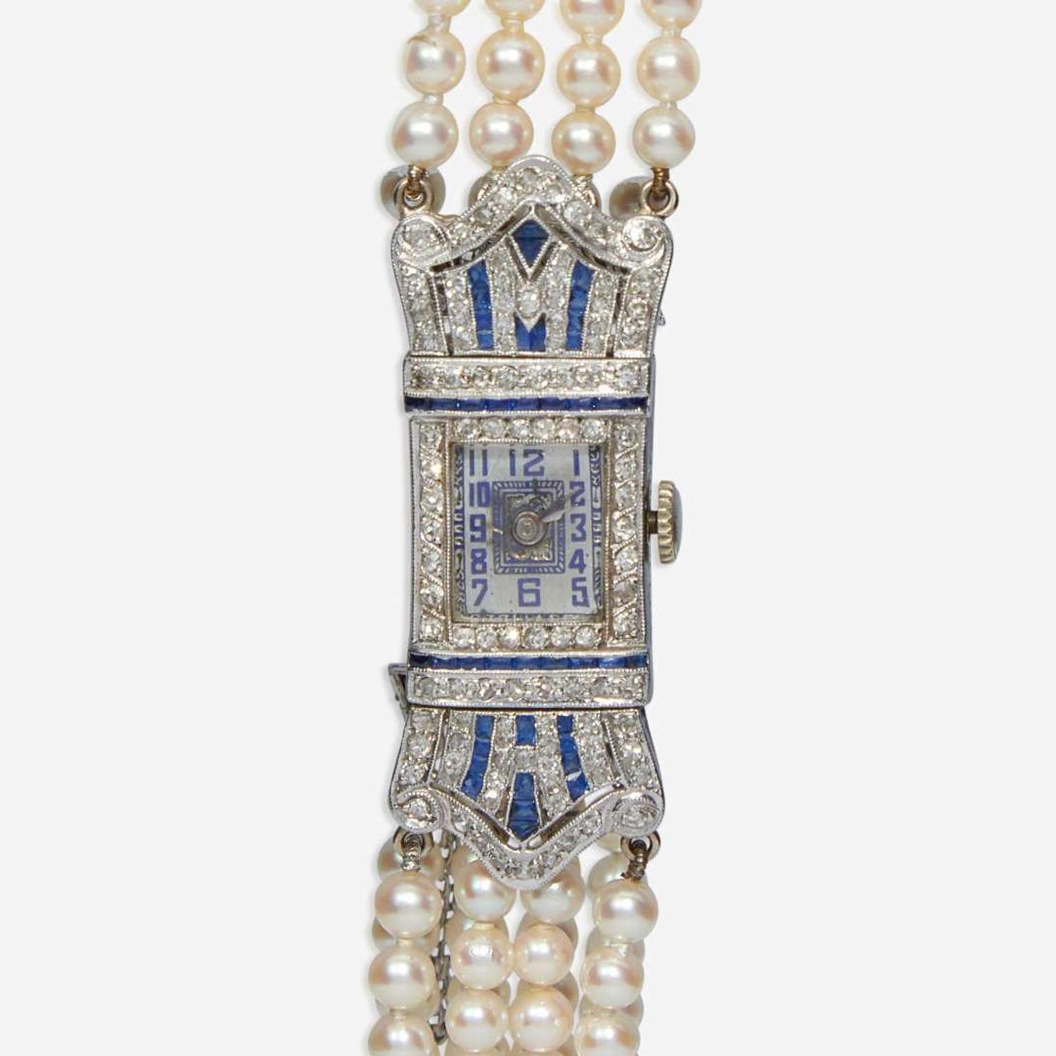 An Art Deco Pearl, Diamond, and Sapphire Watch