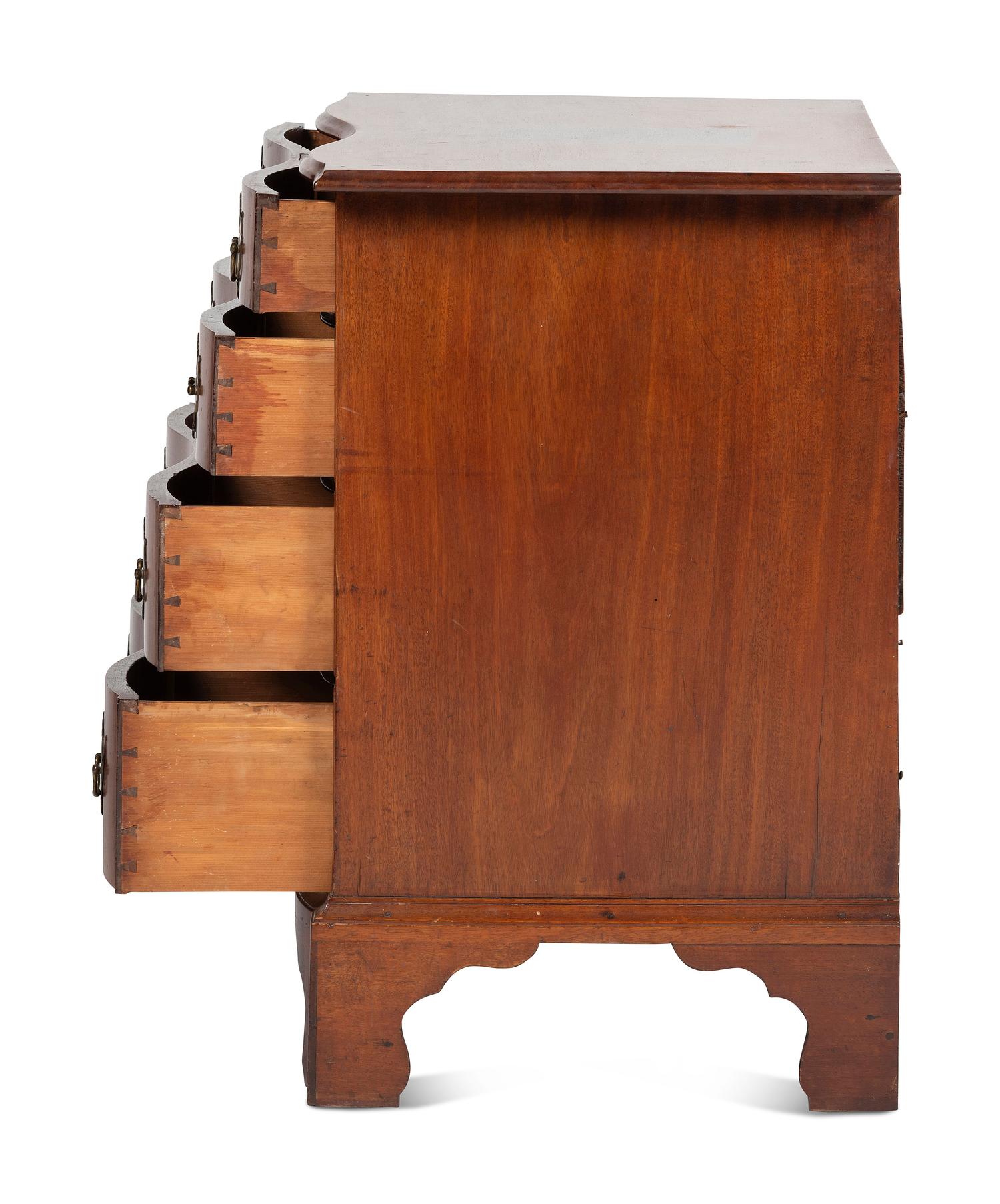 A Chippendale Carved Mahogany Reverse Serpentine Chest of Drawers, 18th Century