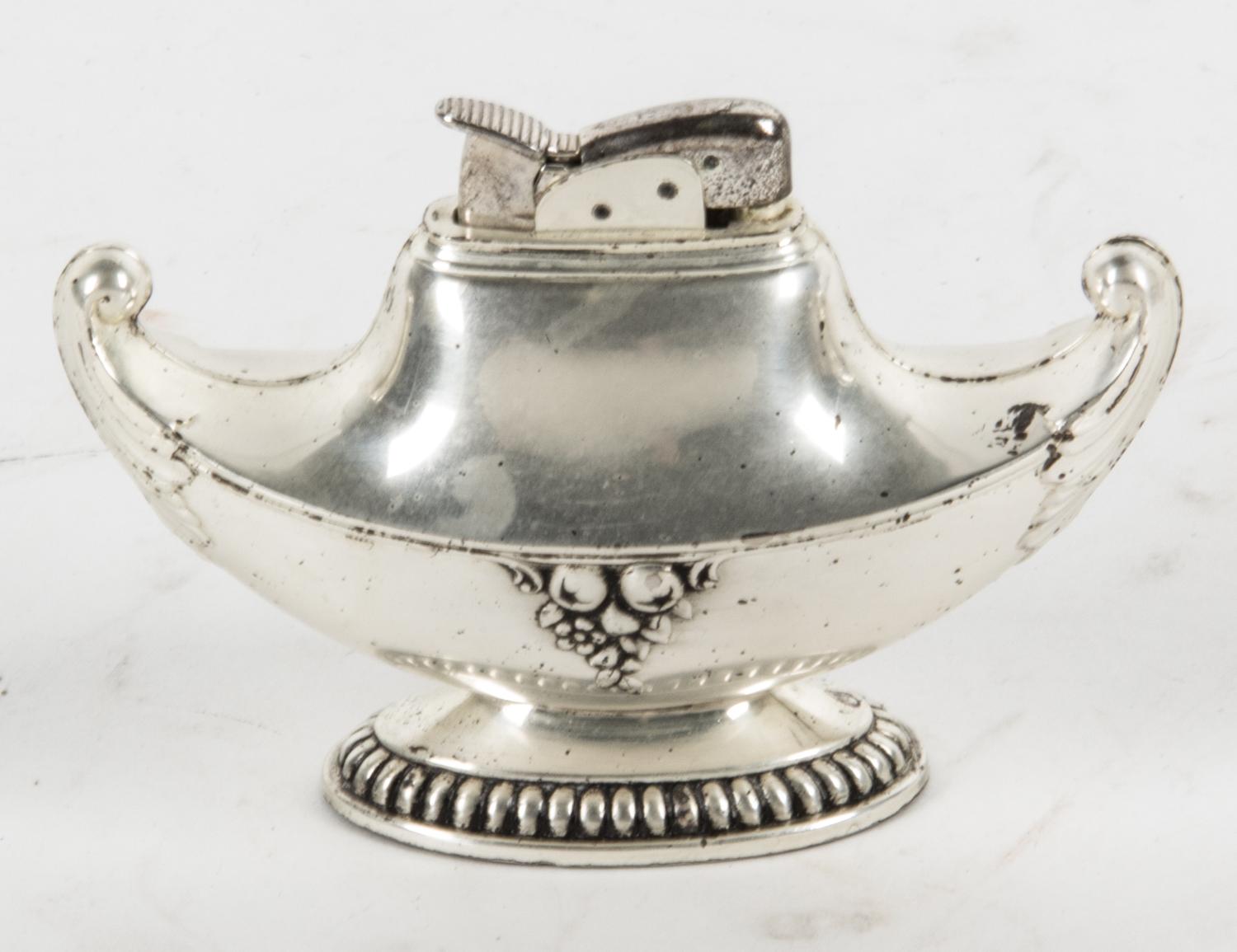 A Silver-Plate Table Lighter Height 2 1/2 x width 4 1/4 inches.