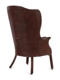 An English Leather Upholstered Mahogany Wingback Armchair