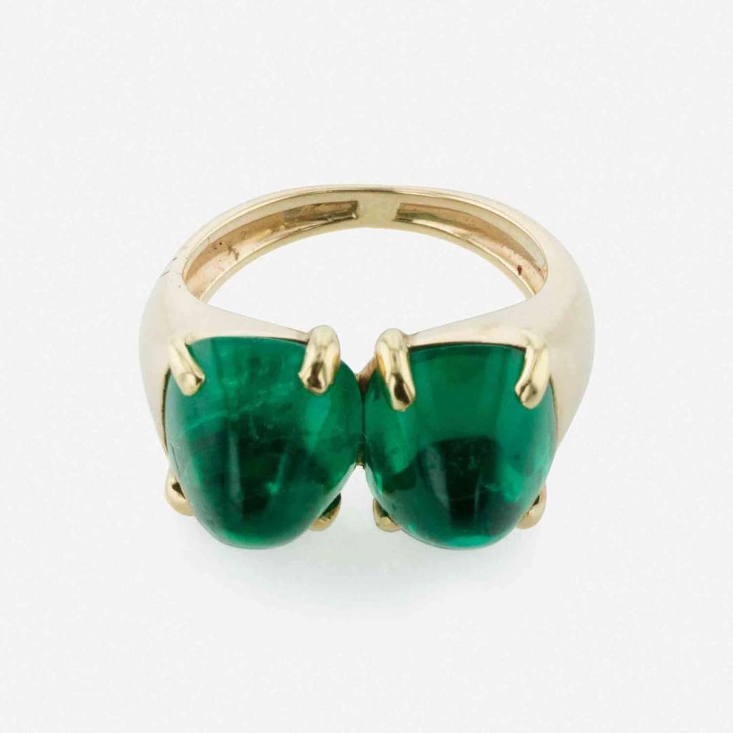 A Yellow Gold and Sugarloaf Emerald Ring
