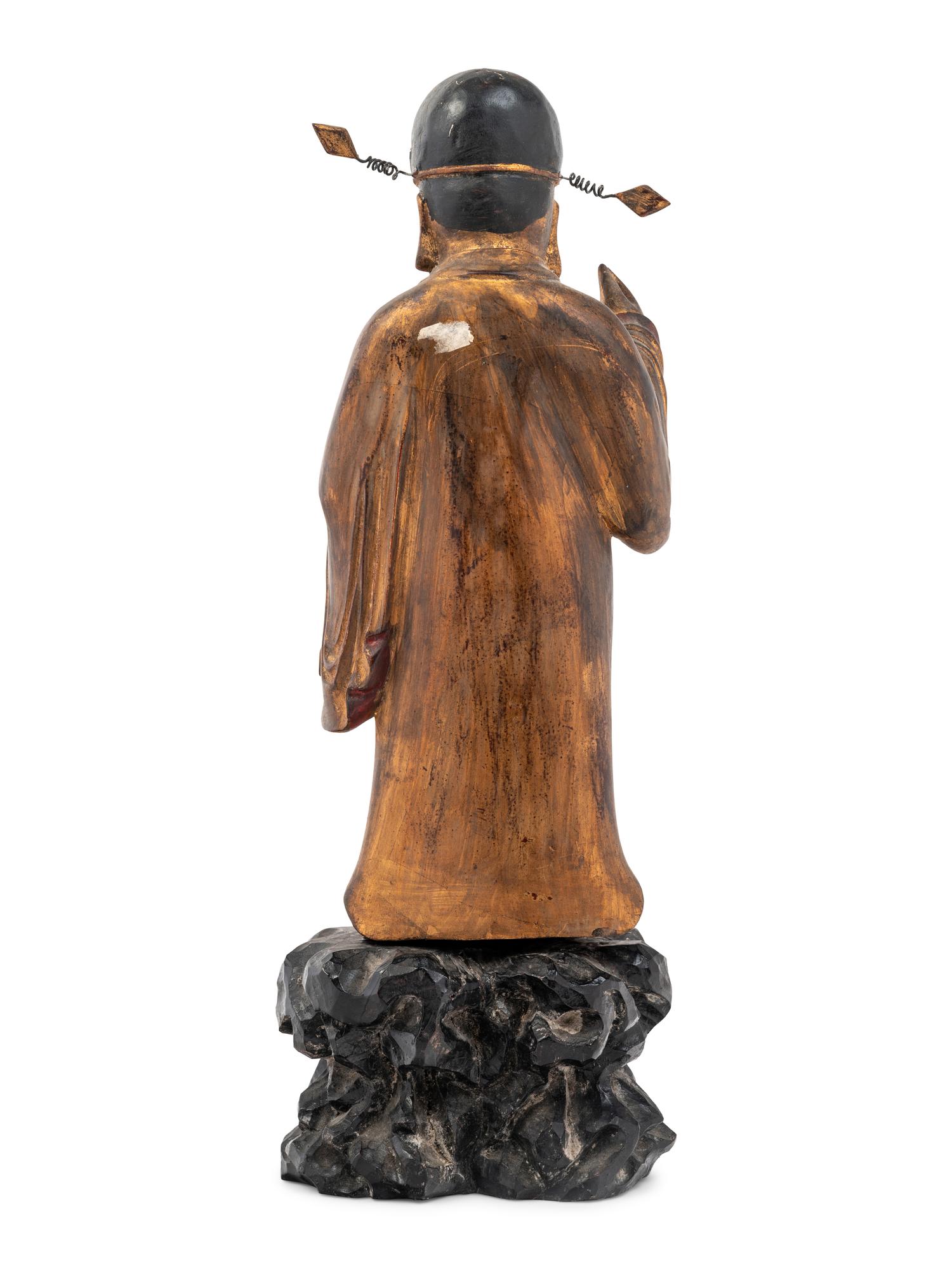 A Chinese Gilt Decorated Wood Figure of a Standing Official