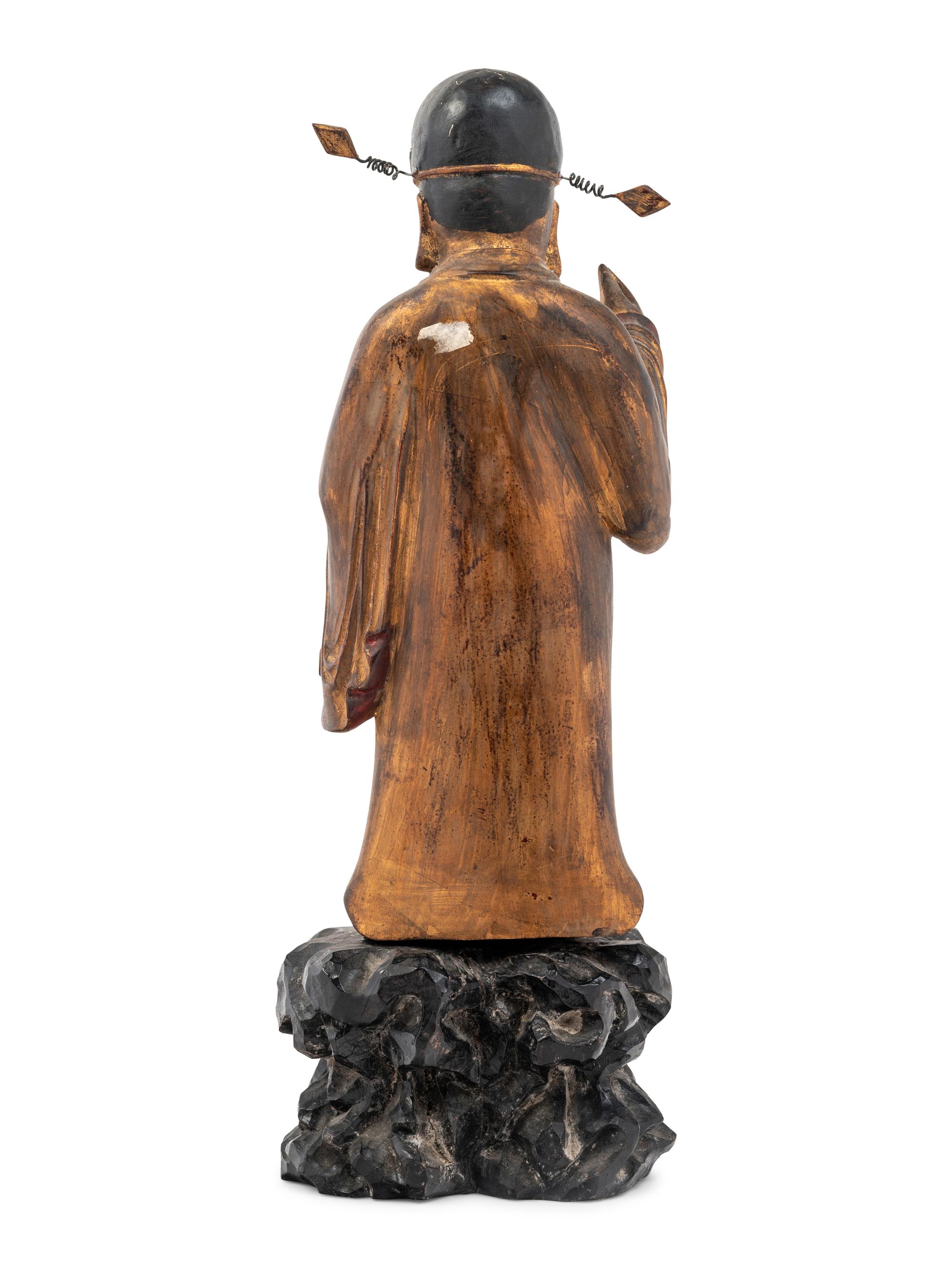 A Chinese Gilt Decorated Wood Figure of a Standing Official