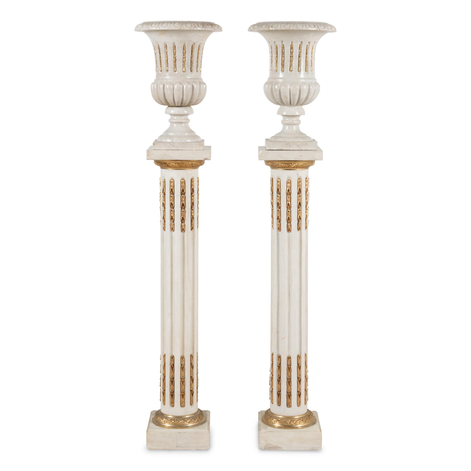 A Pair of Neoclassical Style Gilt Bronze Mounted Marble Urns on Pedestals
