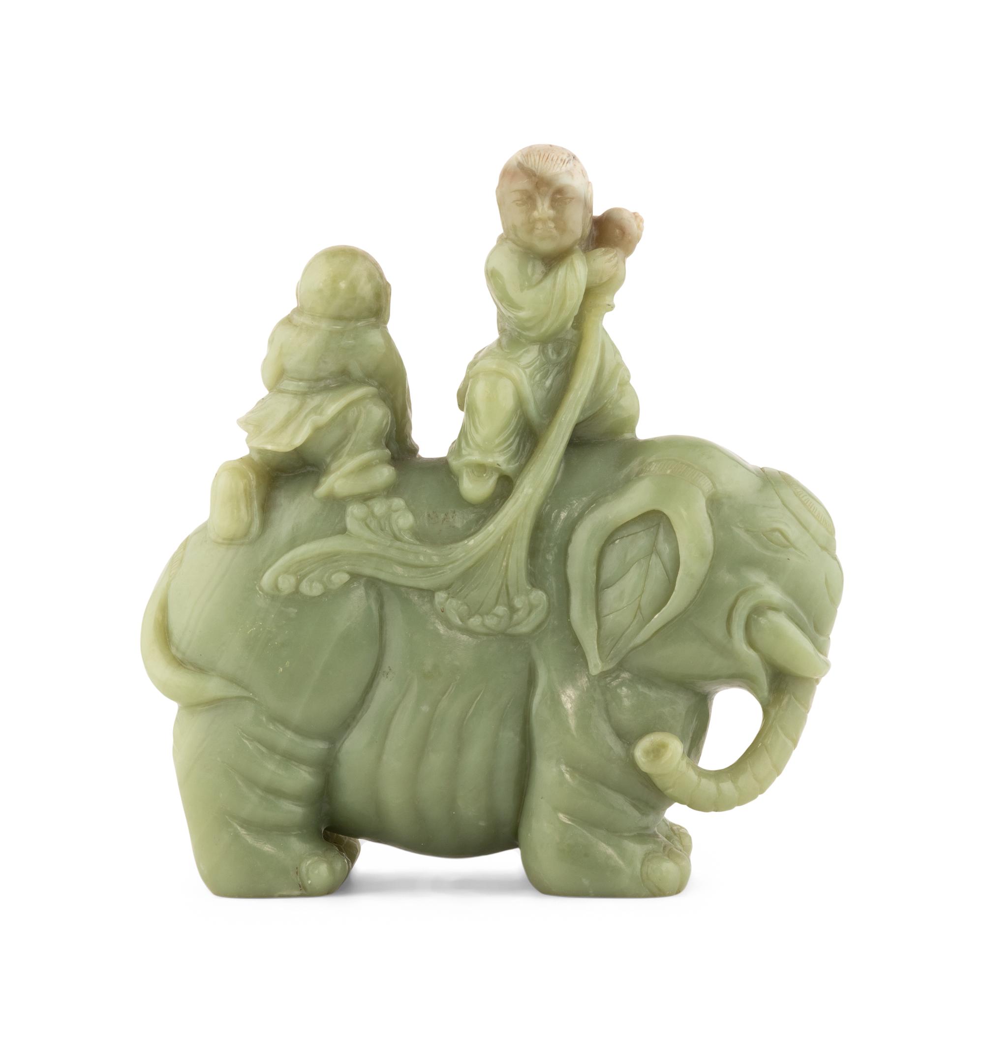 A Chinese Celadon Jade Figural Group of Boys Riding an Elephant