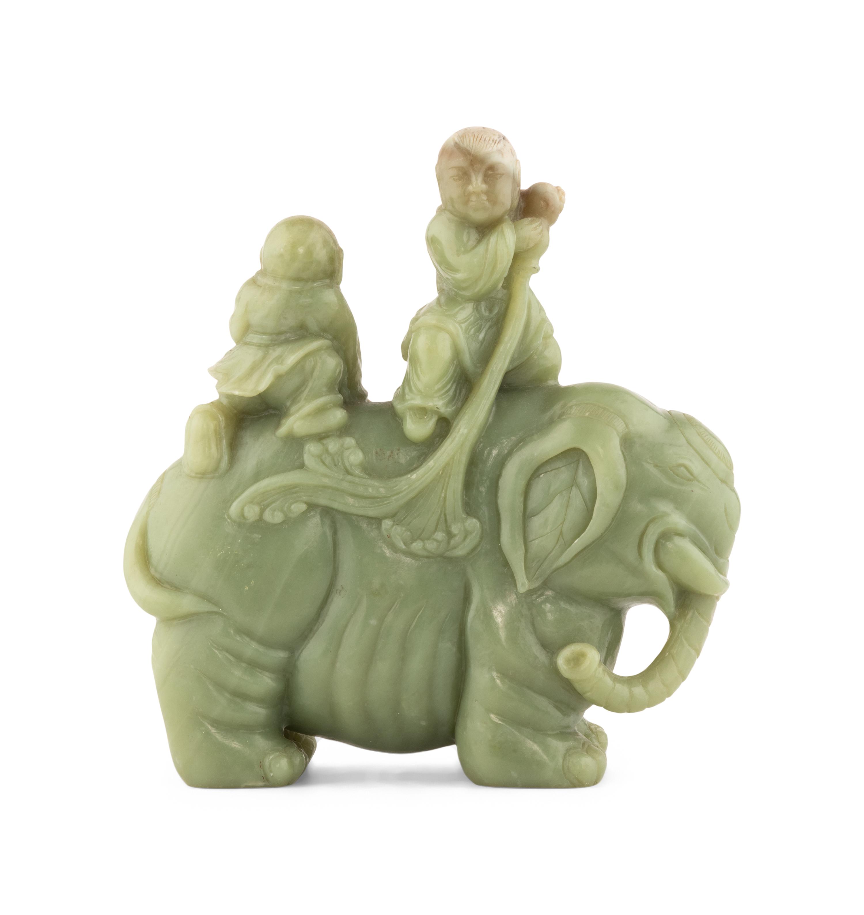 A Chinese Celadon Jade Figural Group of Boys Riding an Elephant