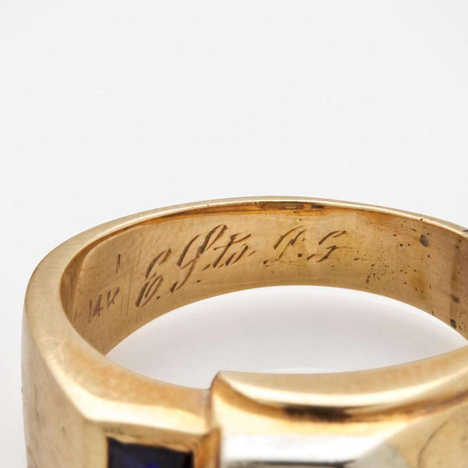 A Collection of Four Men's Yellow Gold and Gemstone Rings