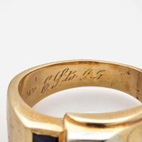A Collection of Four Men's Yellow Gold and Gemstone Rings