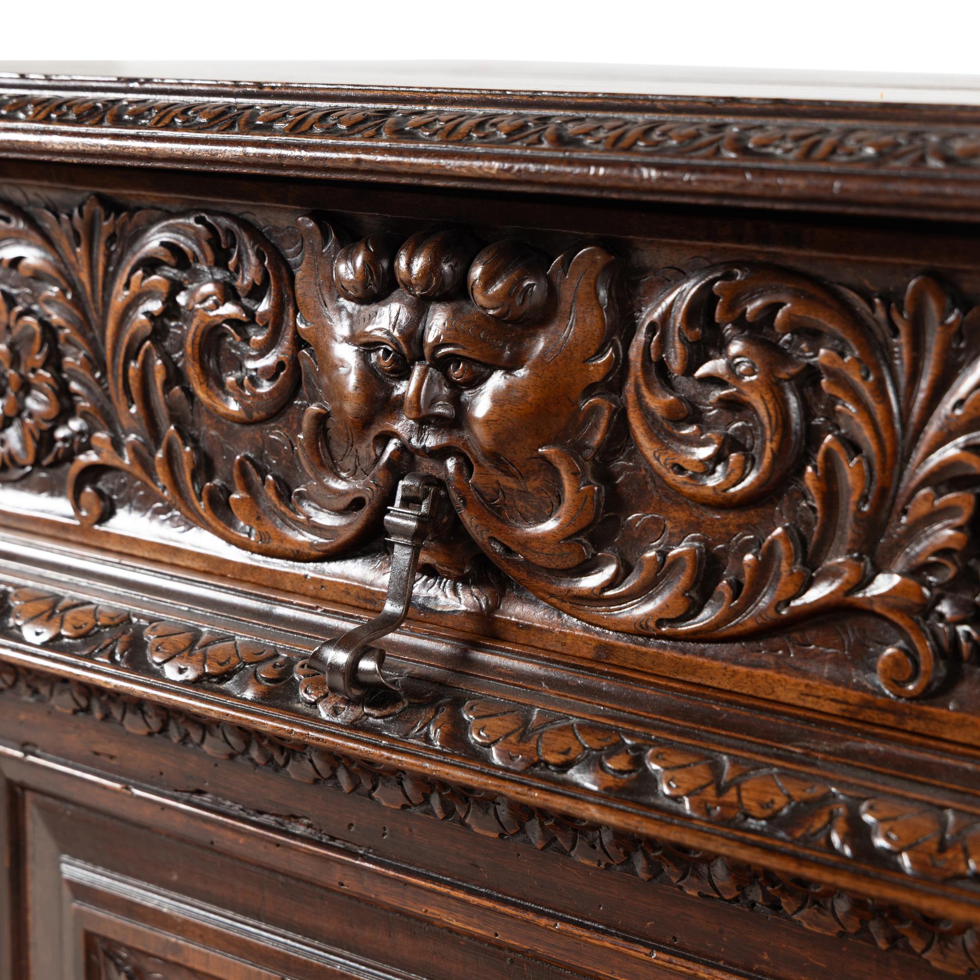 An Italian Baroque Style Carved Walnut Console Cabinet