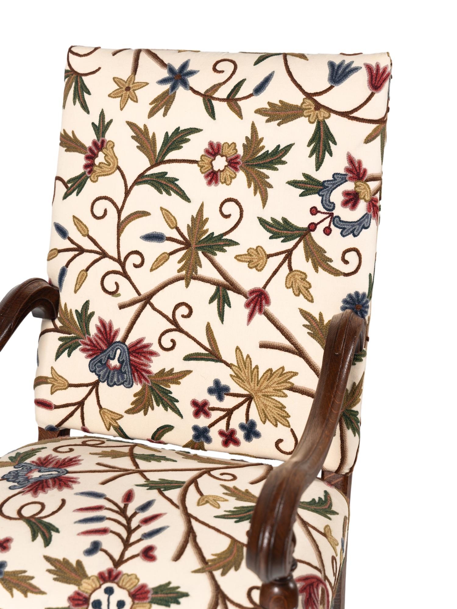 A Pair of William and Mary Style Walnut Armchairs with Crewelwork Upholstery