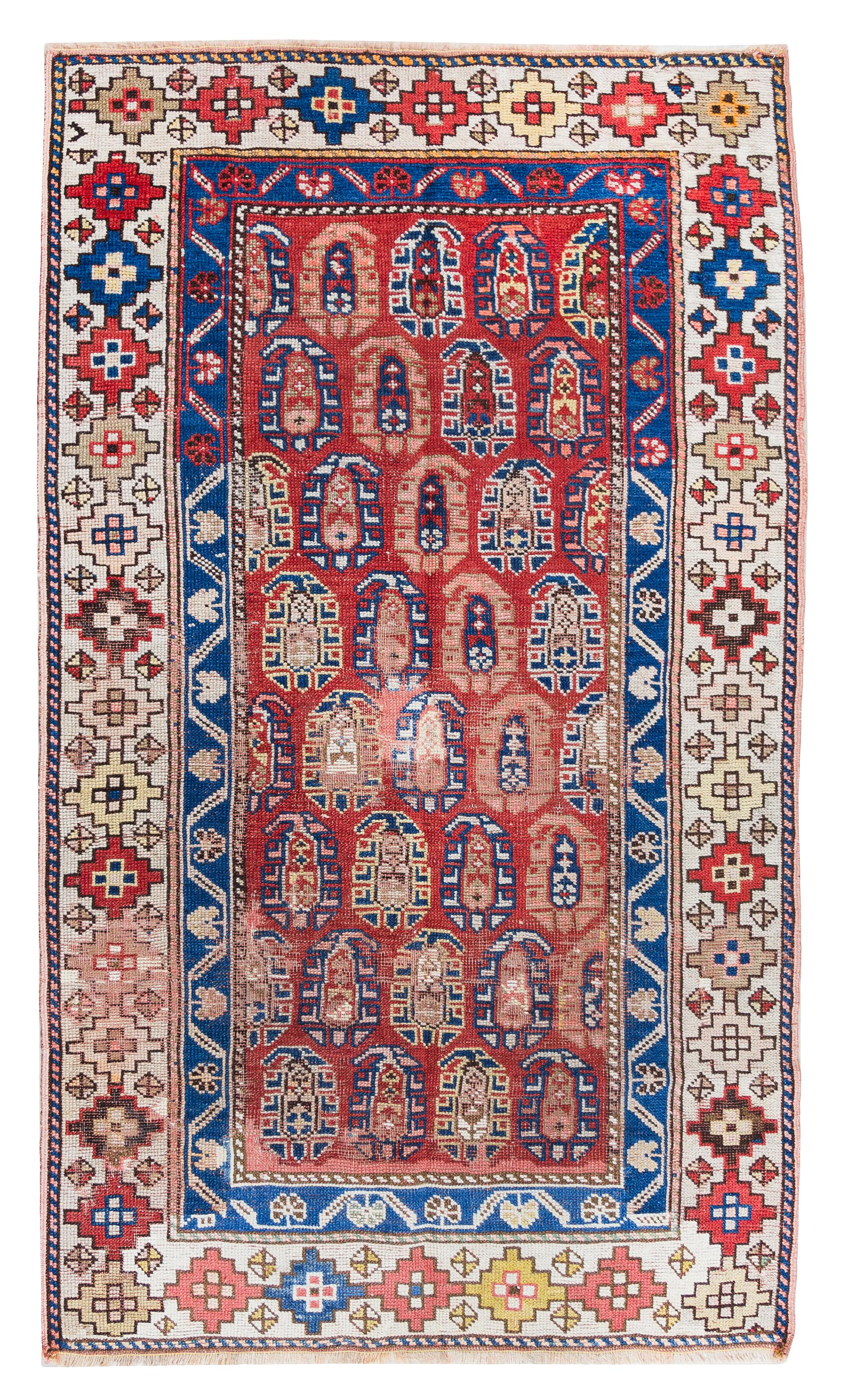 A Caucasian Wool Rug 5 feet 5 inches x 3 feet 3 inches. — FIRST HALF 20TH CENTURY