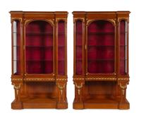 A Pair of Louis XVI Style Gilt Bronze and Metal Mounted Walnut Vitrine Cabinets