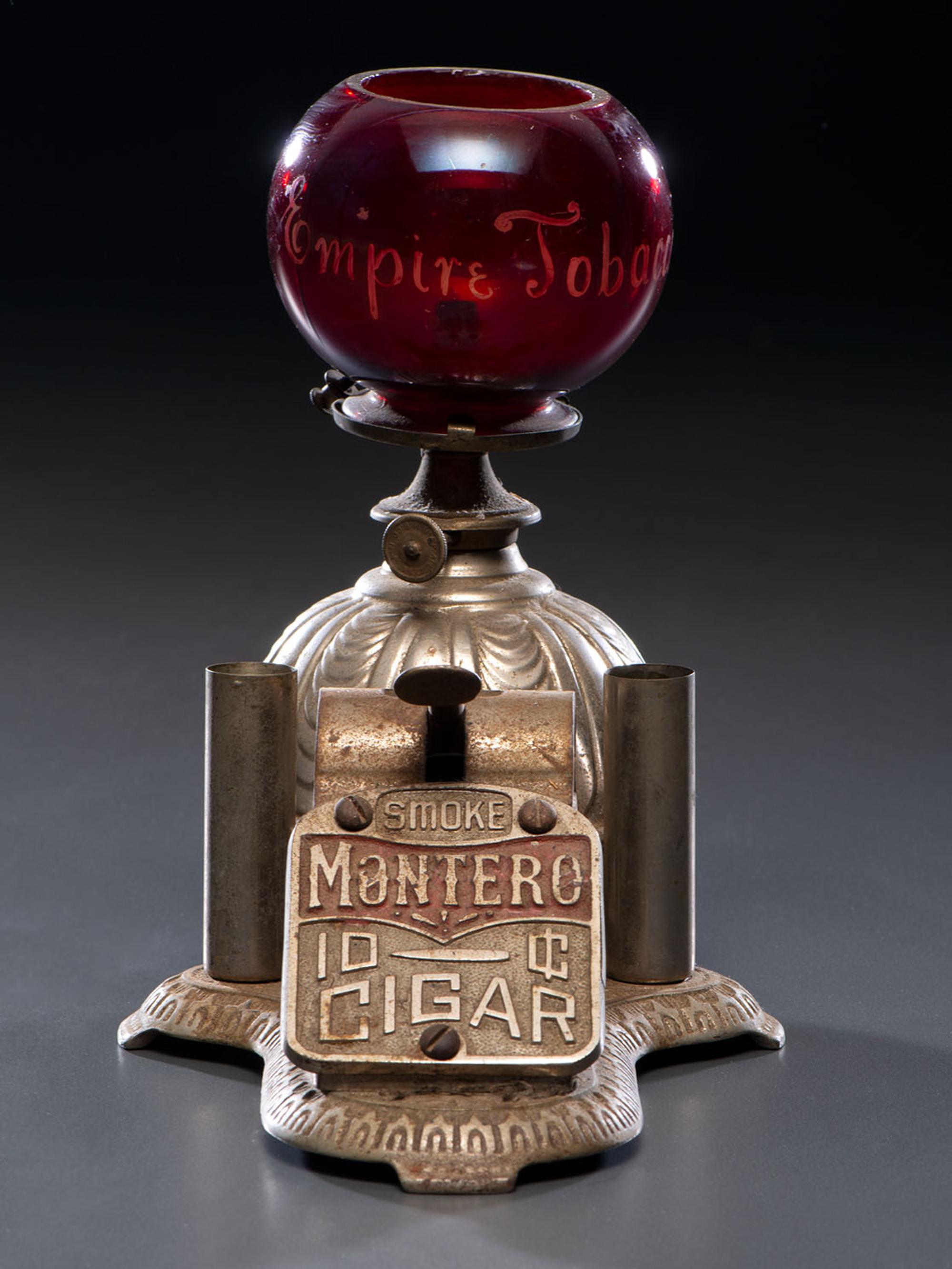 A Cast Iron Cigar Cutter with Lighter