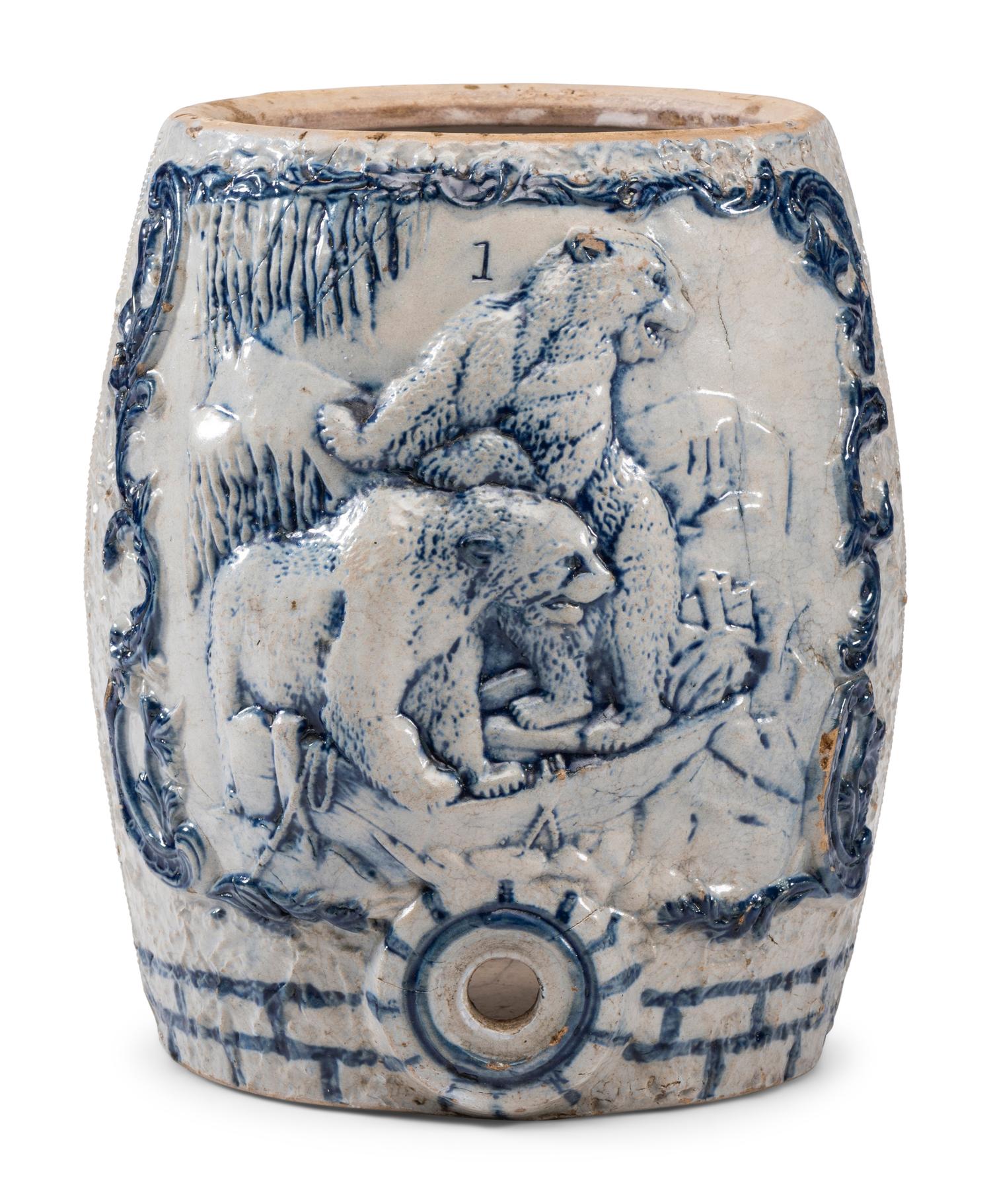 A Cobalt-Decorated Molded Stoneware Water Cooler with Bear Decoration