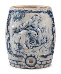A Cobalt-Decorated Molded Stoneware Water Cooler with Bear Decoration
