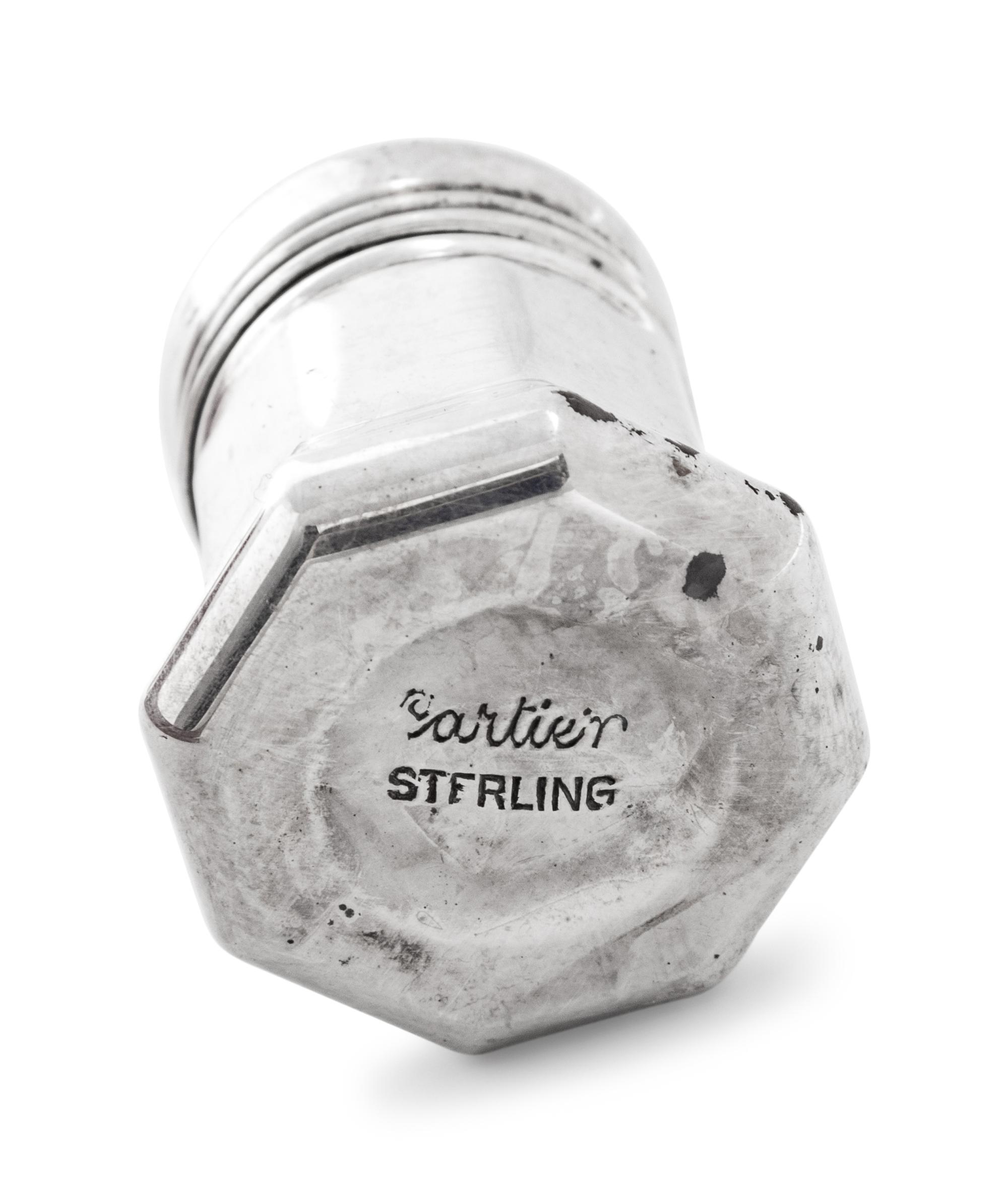 A Set of Sixteen Cartier Silver Casters