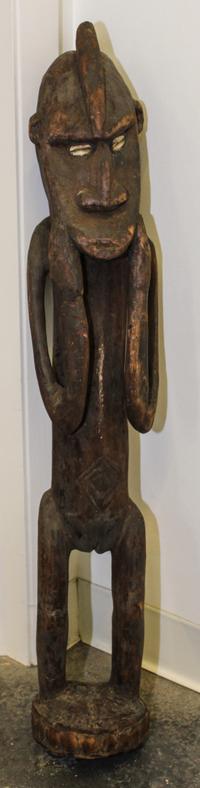 A New Guinea Tribal Carved Wood and Cowry Shell Figure Height 34 inches. — SEPIK RIVER AREA