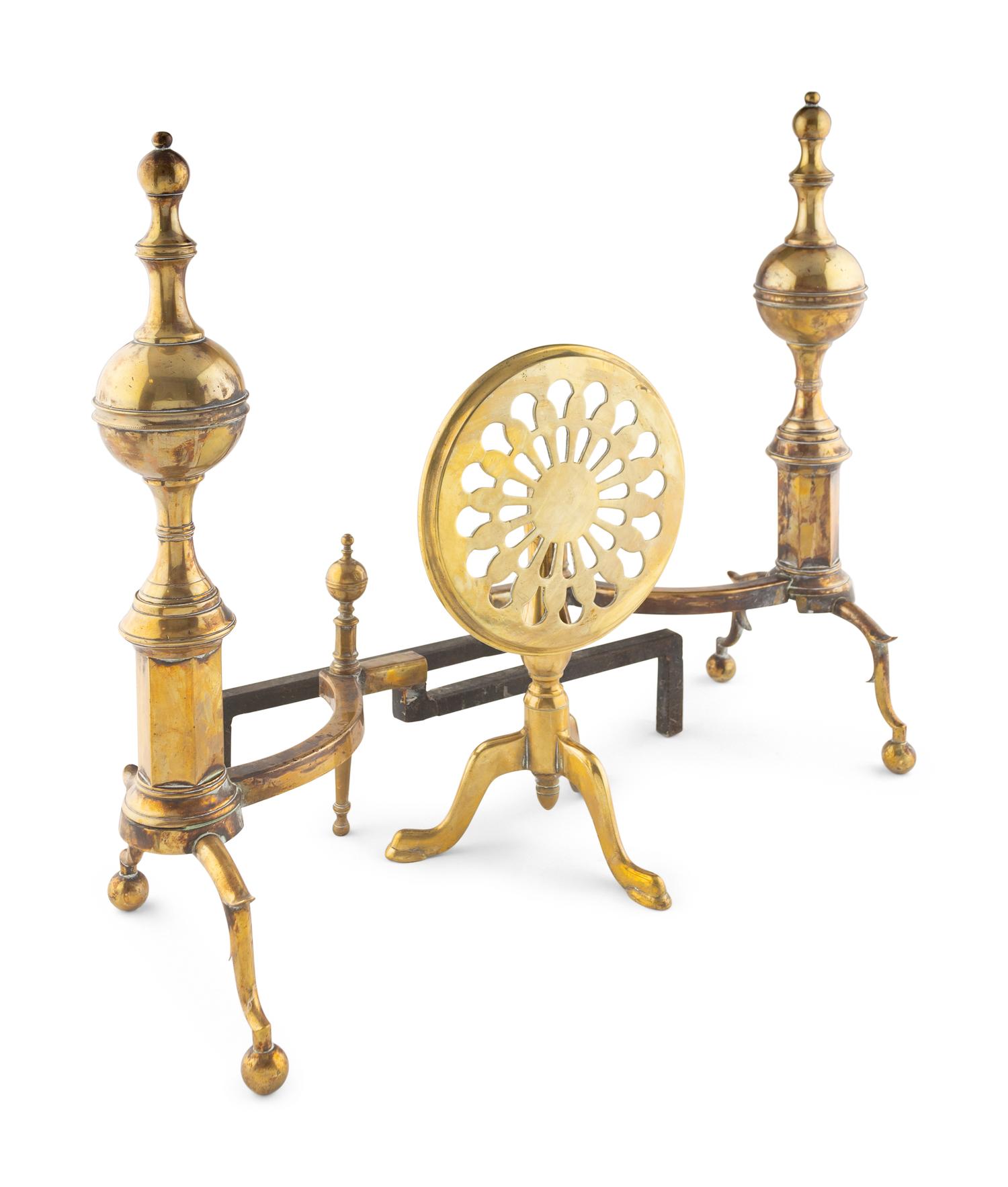A Pair of Brass Andirons and a Fireplace Trivet