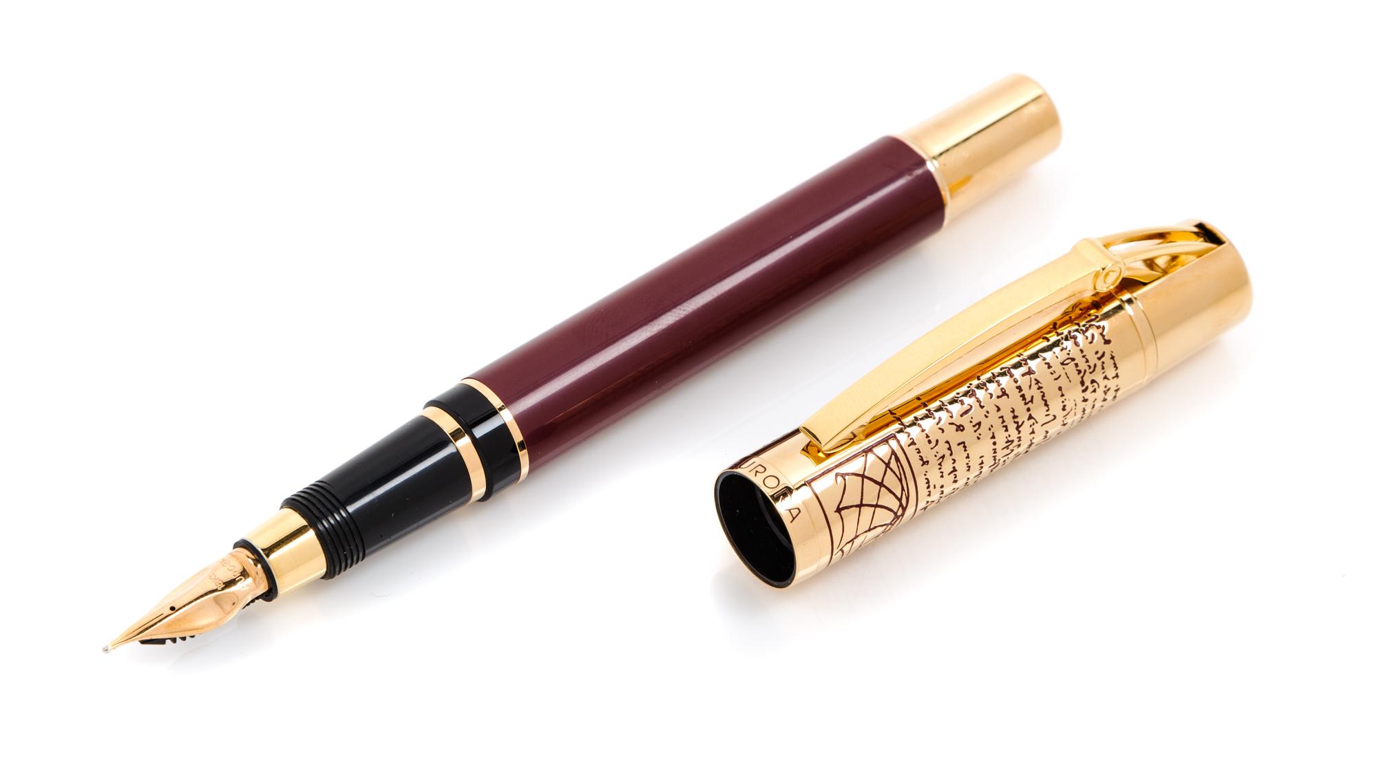 An Aurora Leonardo da Vinci Limited Edition Fountain Pen and Paperweight Set