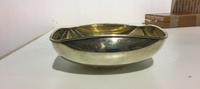 A Mexican Silver Bowl, Los Castillo, Taxco, Mid-20th Century, circular, with pinched sides forming a square and a gilt interior.
