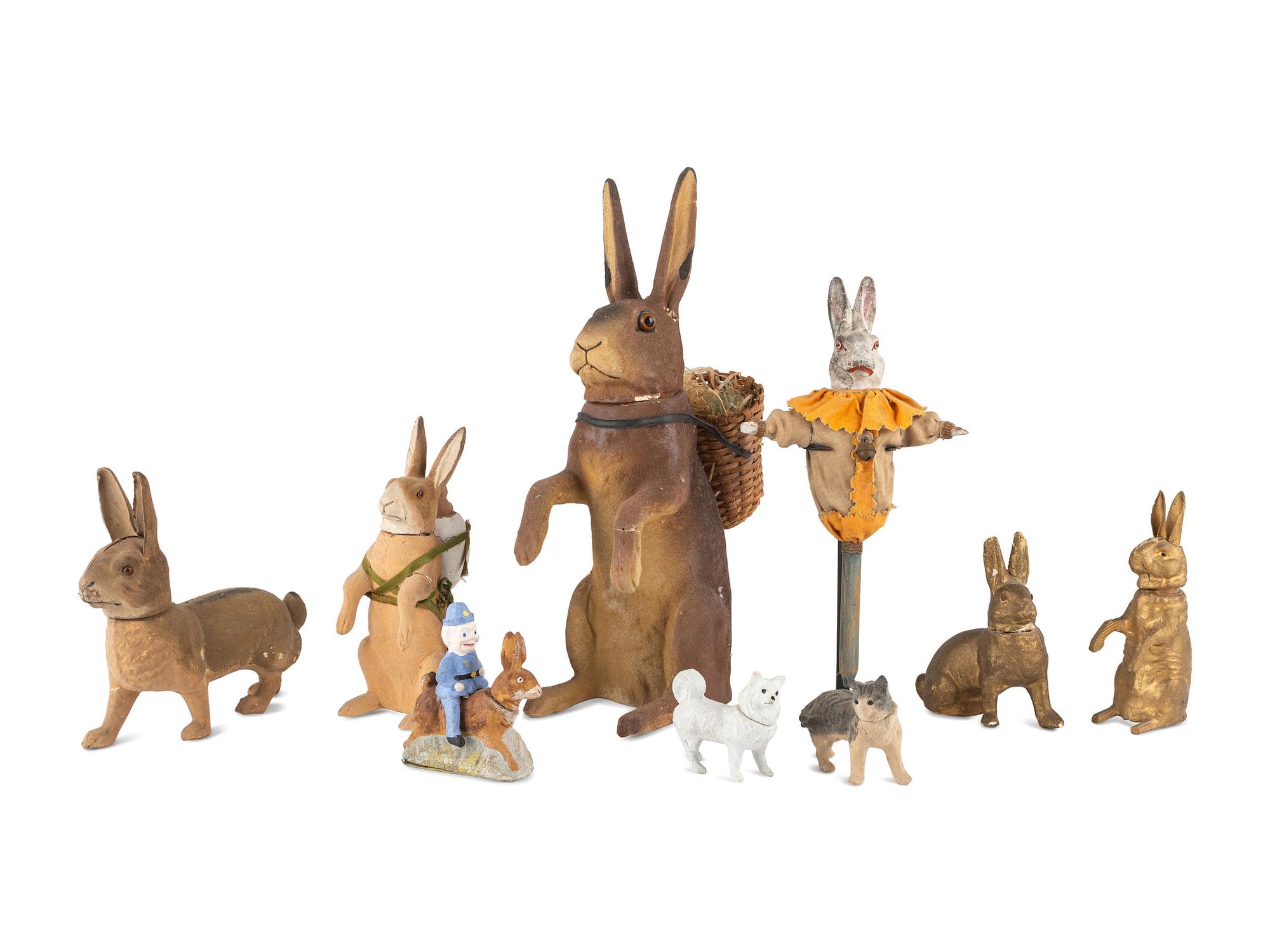 A Collection of German Papier-Mâché Easter Bunnies and Other Figural Candy Canisters