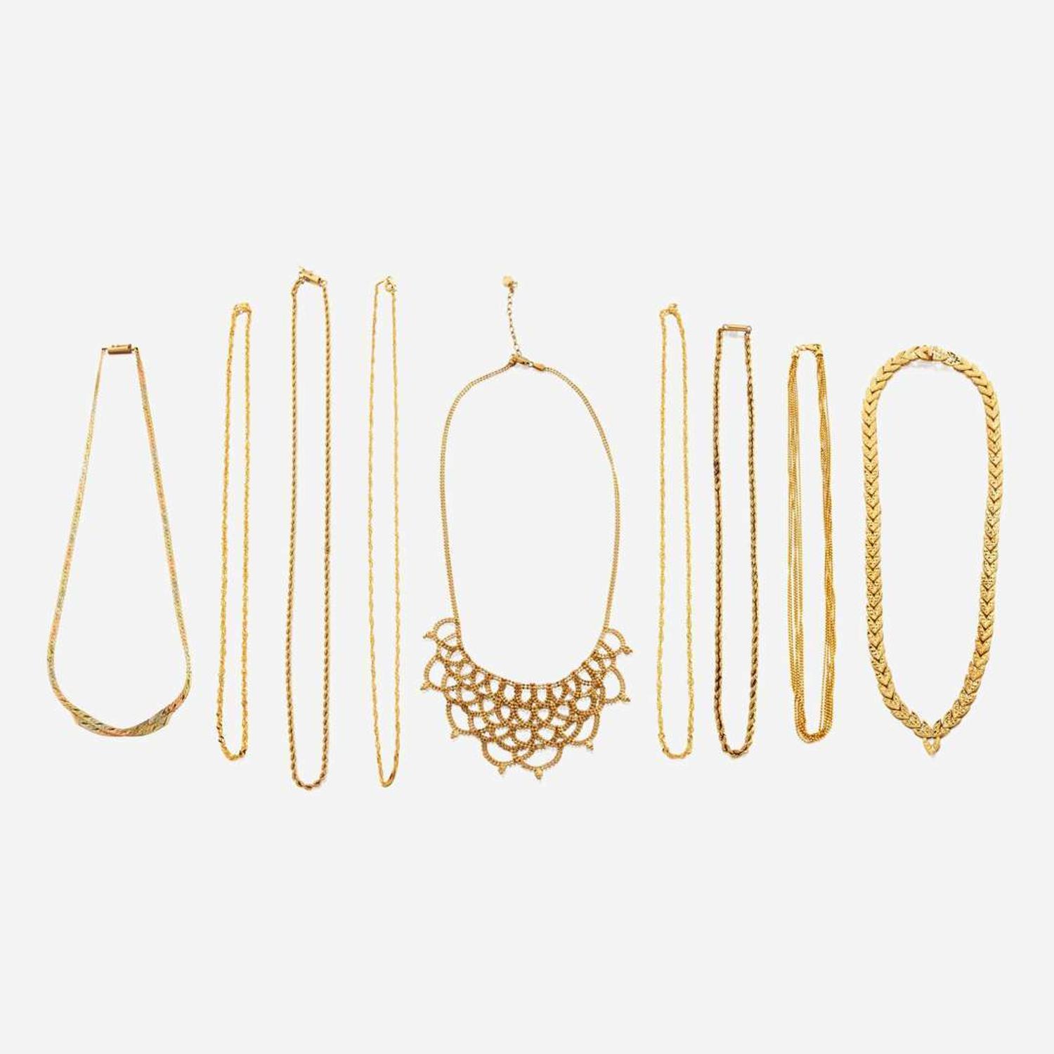 A collection of nine gold necklaces