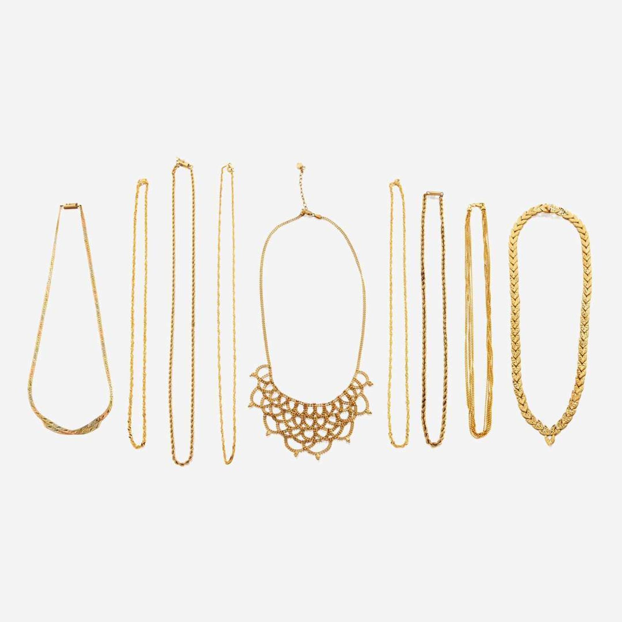 A collection of nine gold necklaces