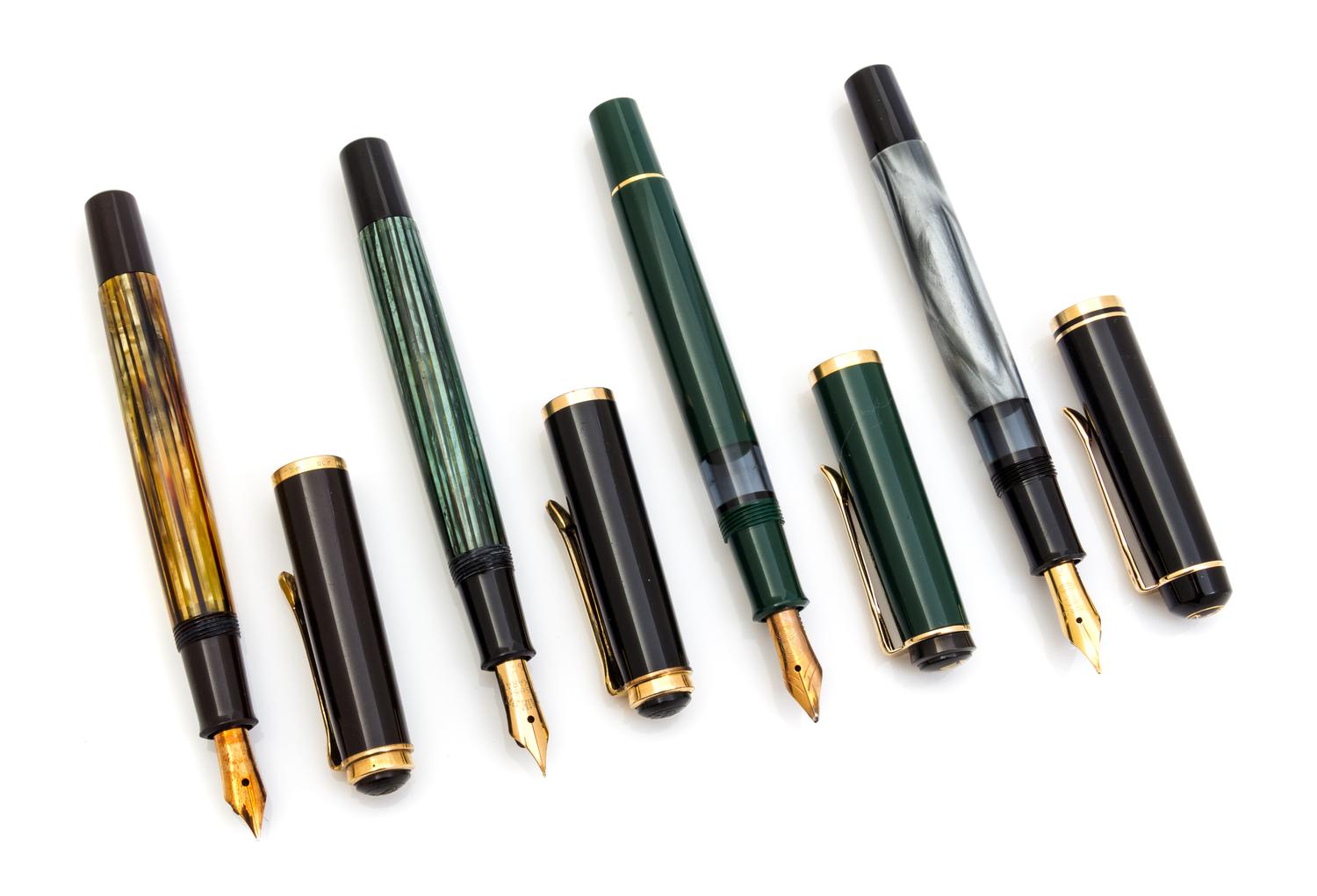 A Set of Four Vintage Pelikan Fountain Pens Length of each 5 inches.