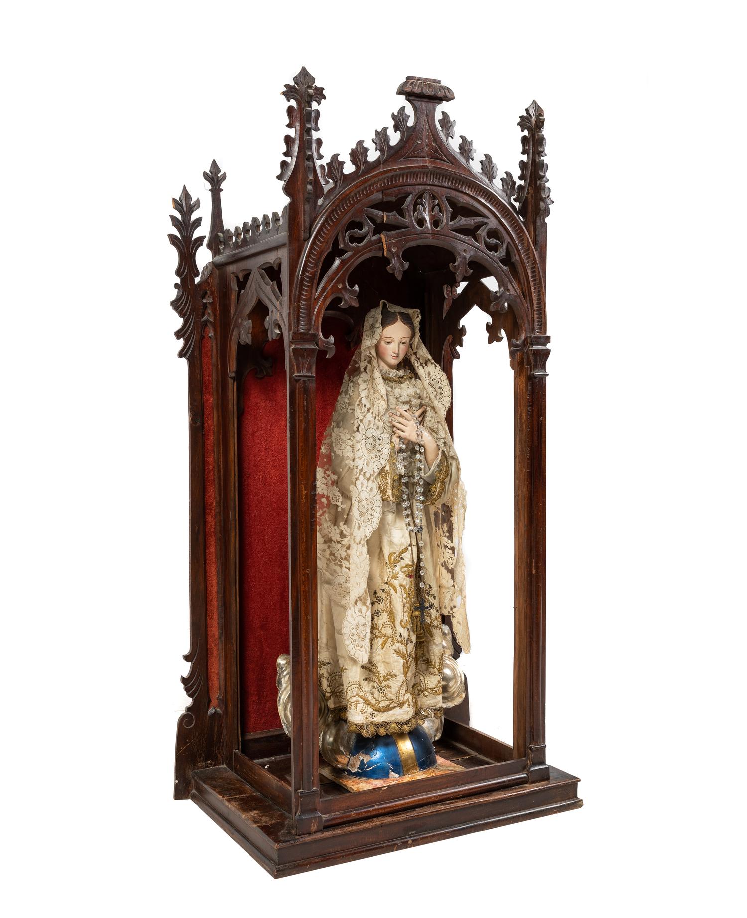 A Gothic Revival Mahogany Reliquary with a Continental Painted Figure of the Madonna