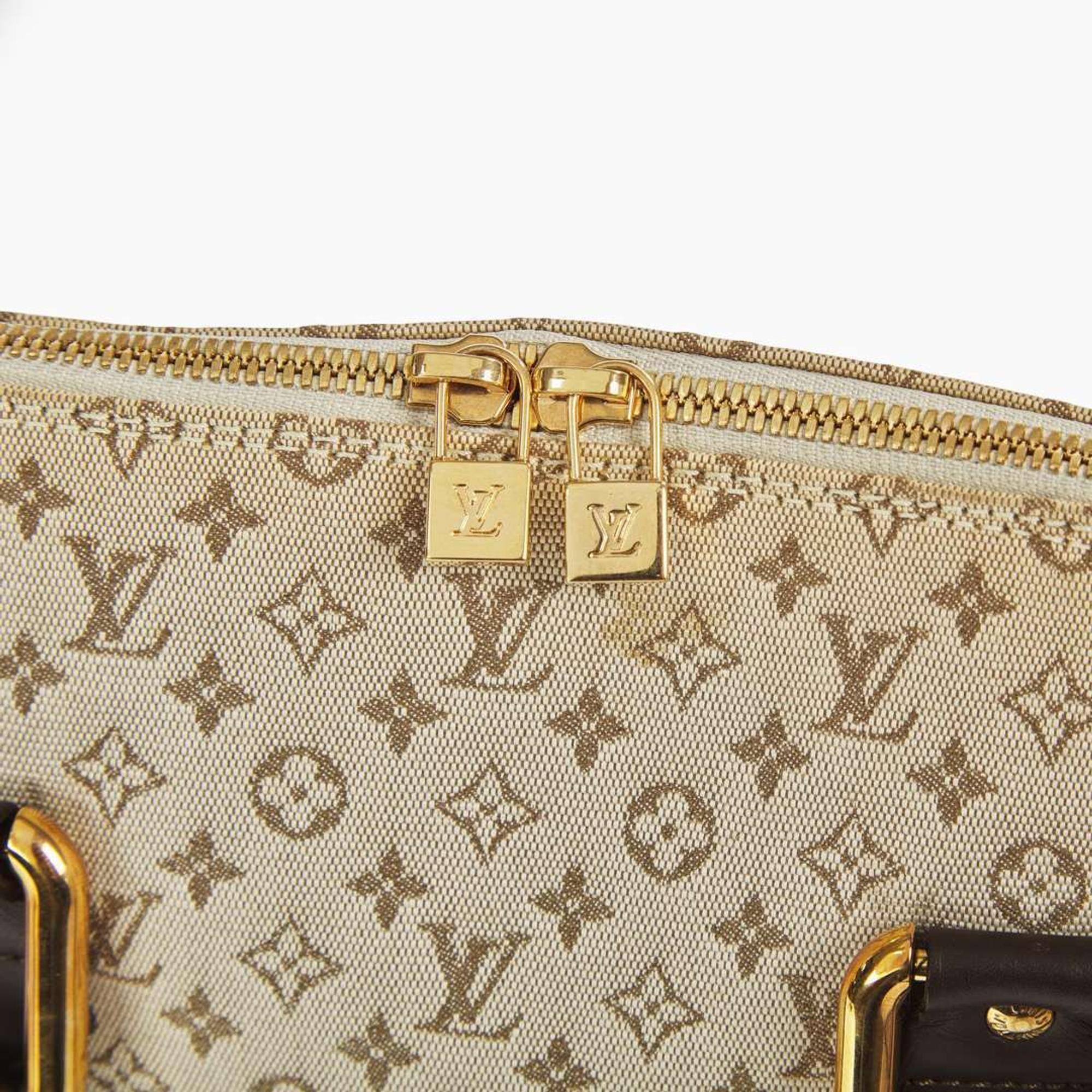 A Louis Vuitton Alma Haut in Khaki Coated Canvas Louis Vuitton