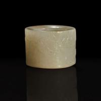 A large pale celadon and russet jade archer ring with Imperial poem and hunting scene 乾隆御题诗狩猎图玉扳指 Qing Dynasty ?