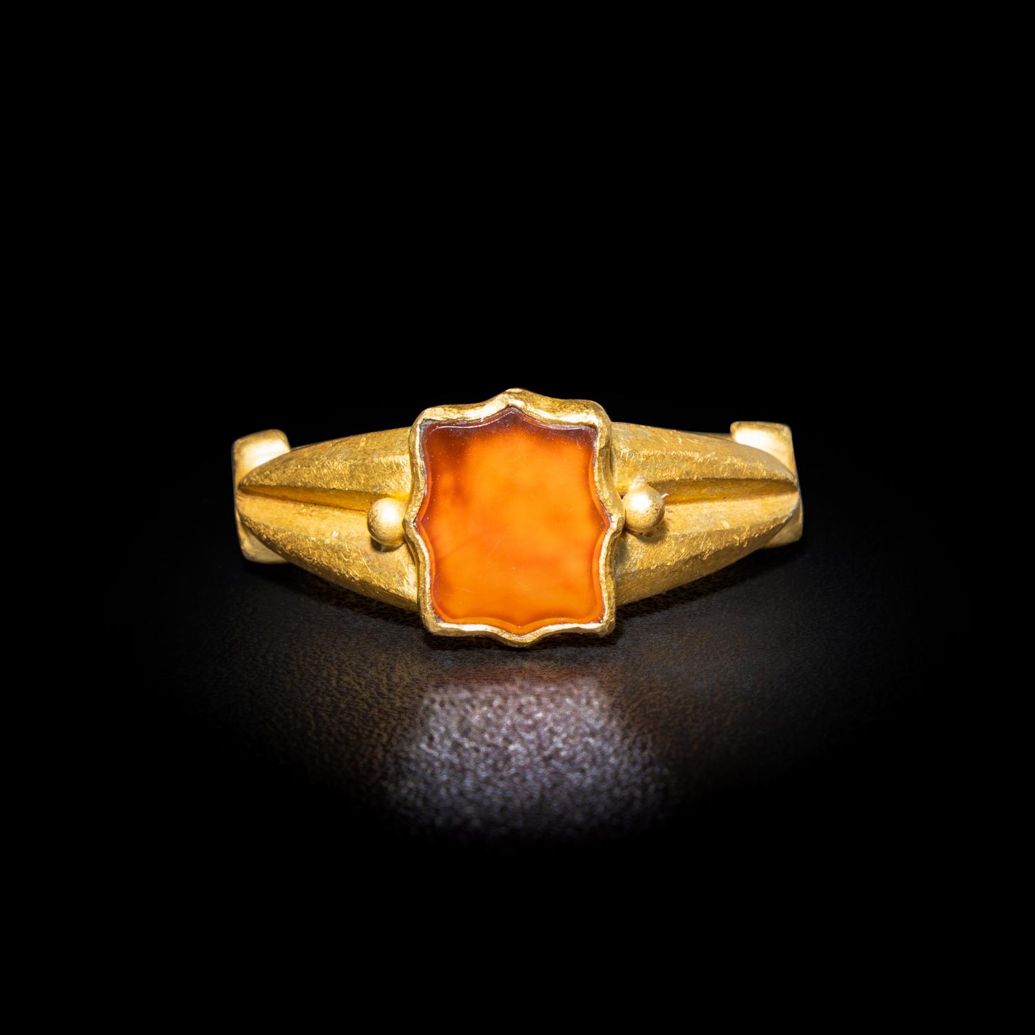A Migration Period Gold and Spessartine Garnet Ring