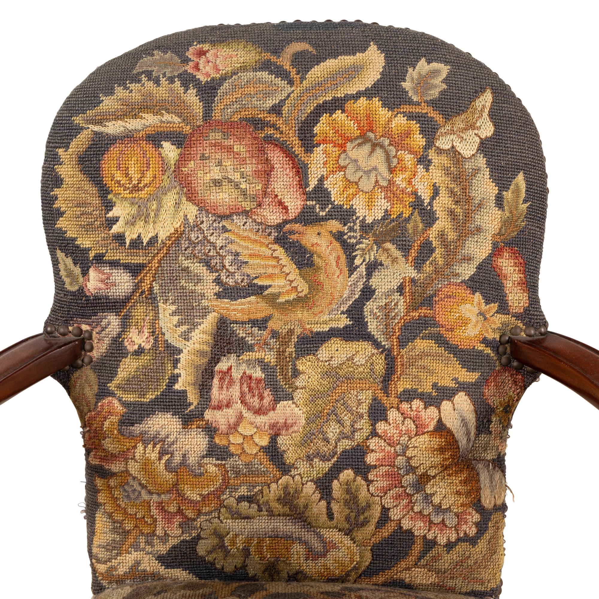 A Pair of George I Style Carved Mahogany and Needlework Upholstered Armchairs