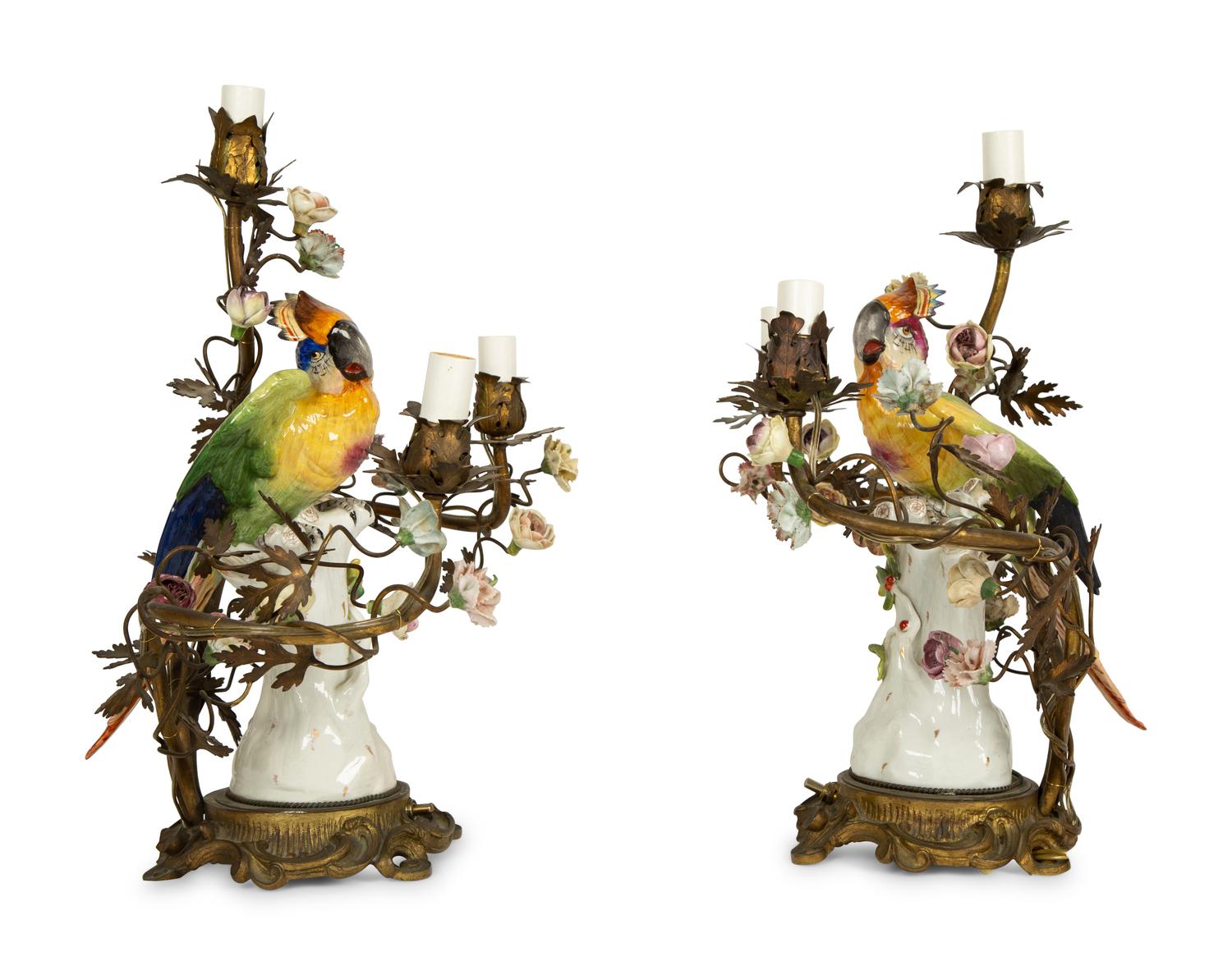 A Near Pair of French Porcelain, Gilt Bronze and Tole Lamps Mounted with Porcelain Parrots — LATE 19TH/EARLY 20TH CENTURY