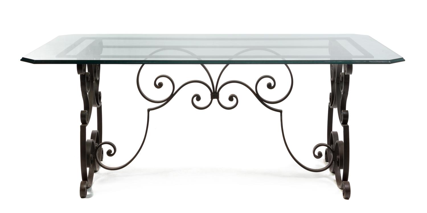A Continental Wrought Iron and Glass Breakfast Table Height 29 1/2 x width 63 1/2 x depth 31 inches.