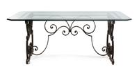 A Continental Wrought Iron and Glass Breakfast Table Height 29 1/2 x width 63 1/2 x depth 31 inches.