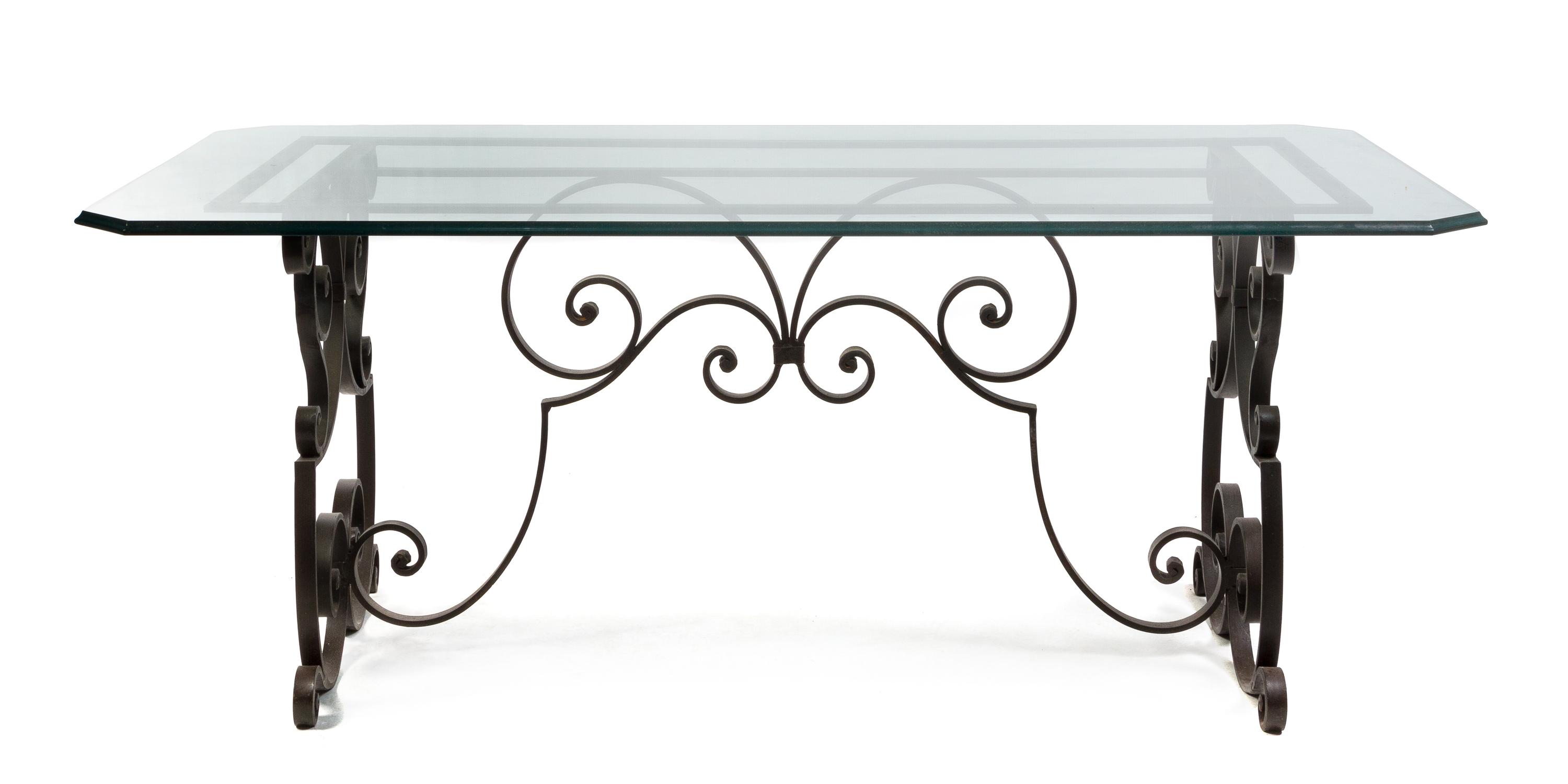 A Continental Wrought Iron and Glass Breakfast Table Height 29 1/2 x width 63 1/2 x depth 31 inches.