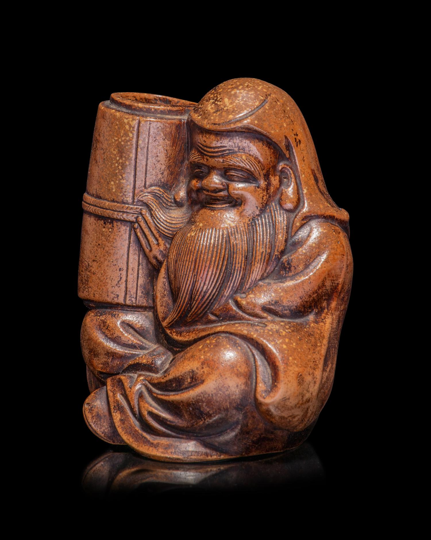 A Japanese Bronze Figure of a Seated Immortal