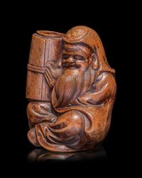 A Japanese Bronze Figure of a Seated Immortal