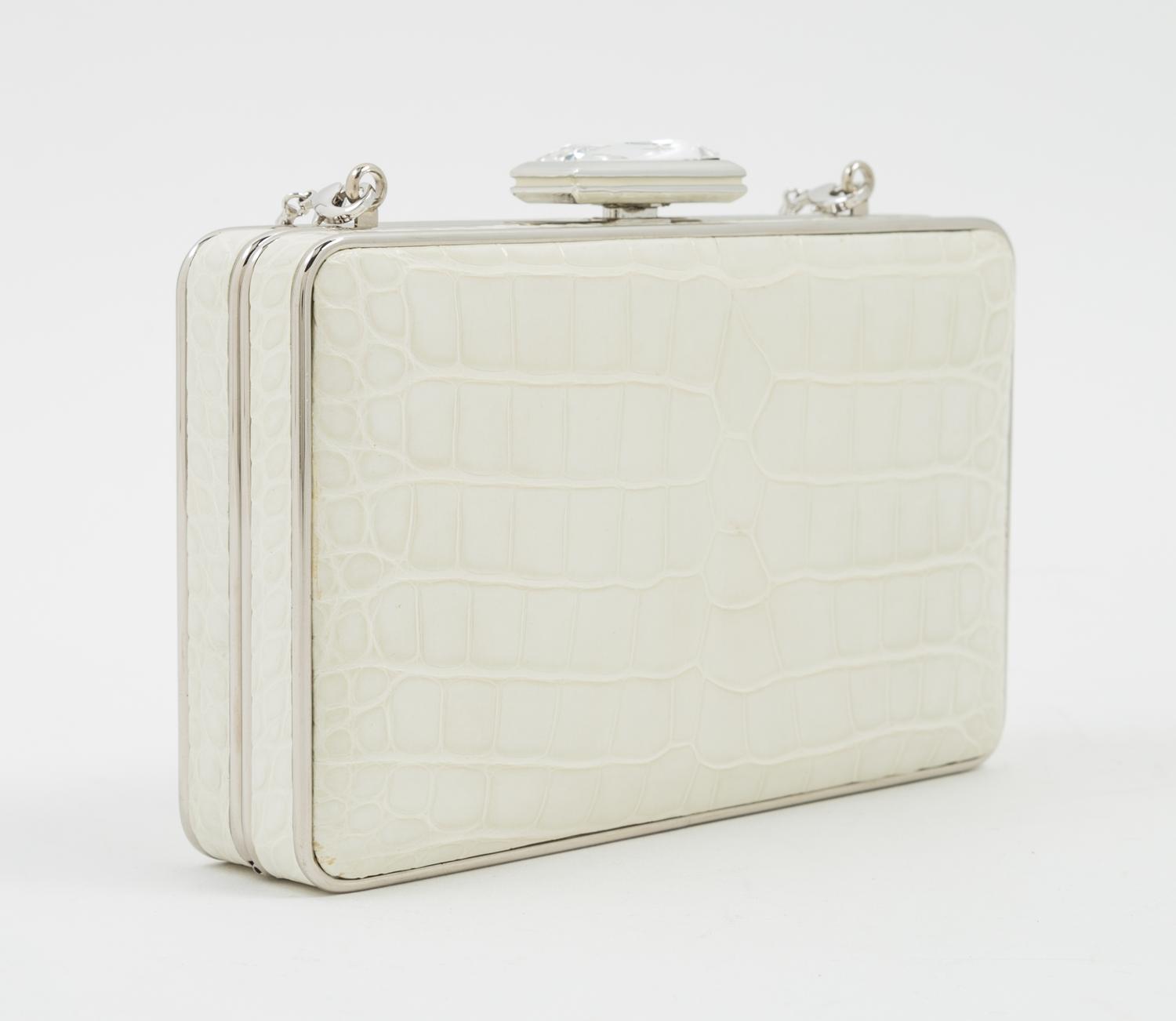 A Judith Leiber Cream Crocodile Clutch, 6" x 3.5" x 1.5".