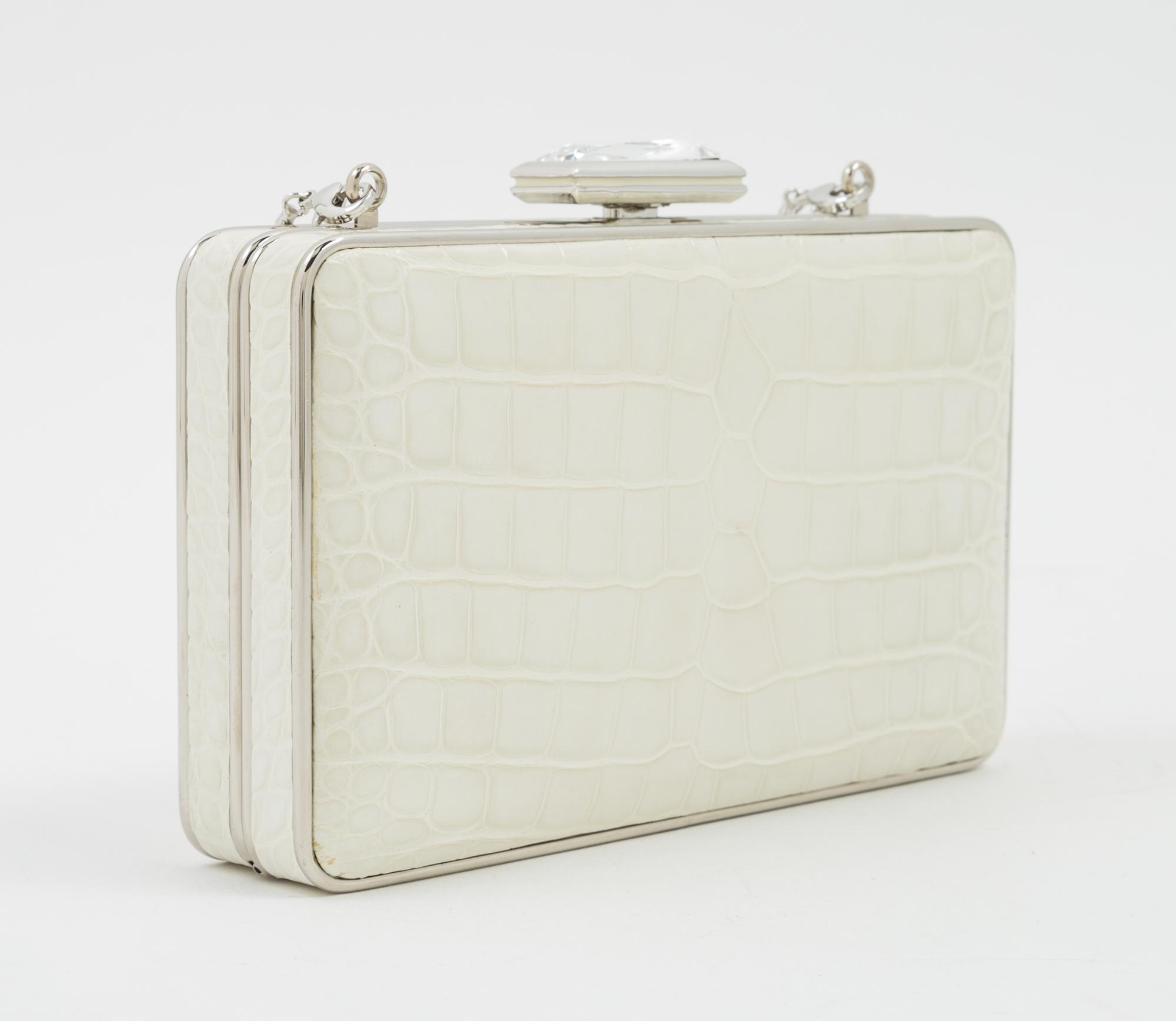 A Judith Leiber Cream Crocodile Clutch, 6" x 3.5" x 1.5".