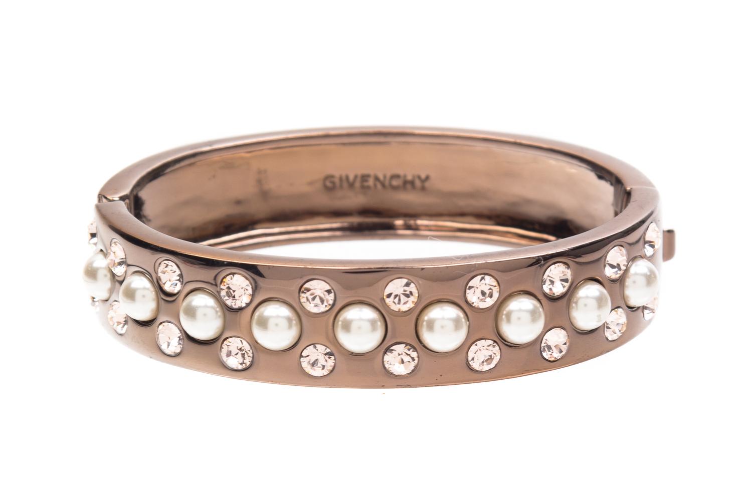 A Givenchy Copper Tone Hinge Bracelet, 2" interior diameter.