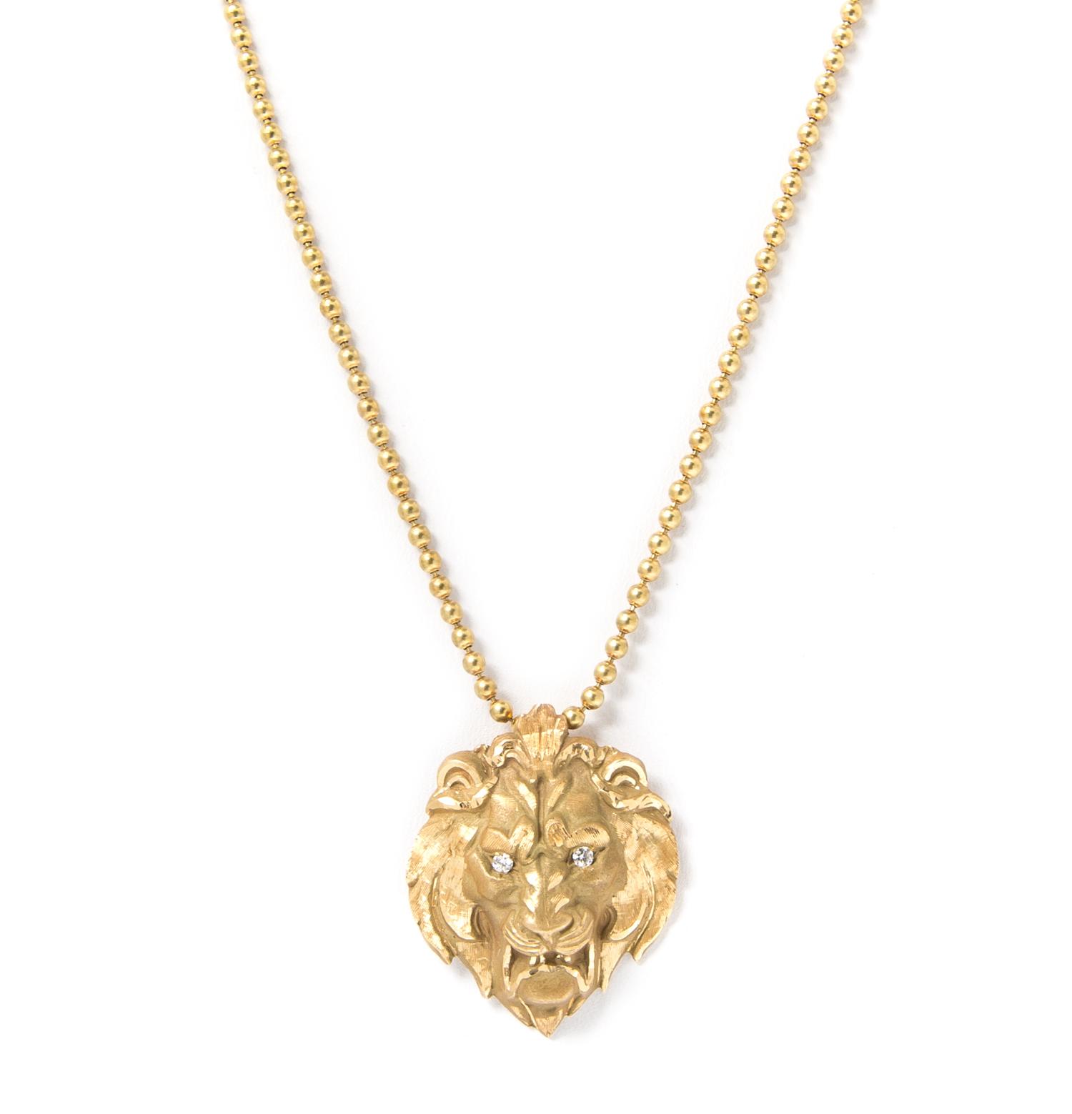 A 14 Karat Yellow Gold and Diamond Lion Pendant Necklace, 10.50 dwts.