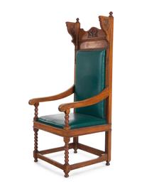 A Jacobean Style Carved Oak Armchair