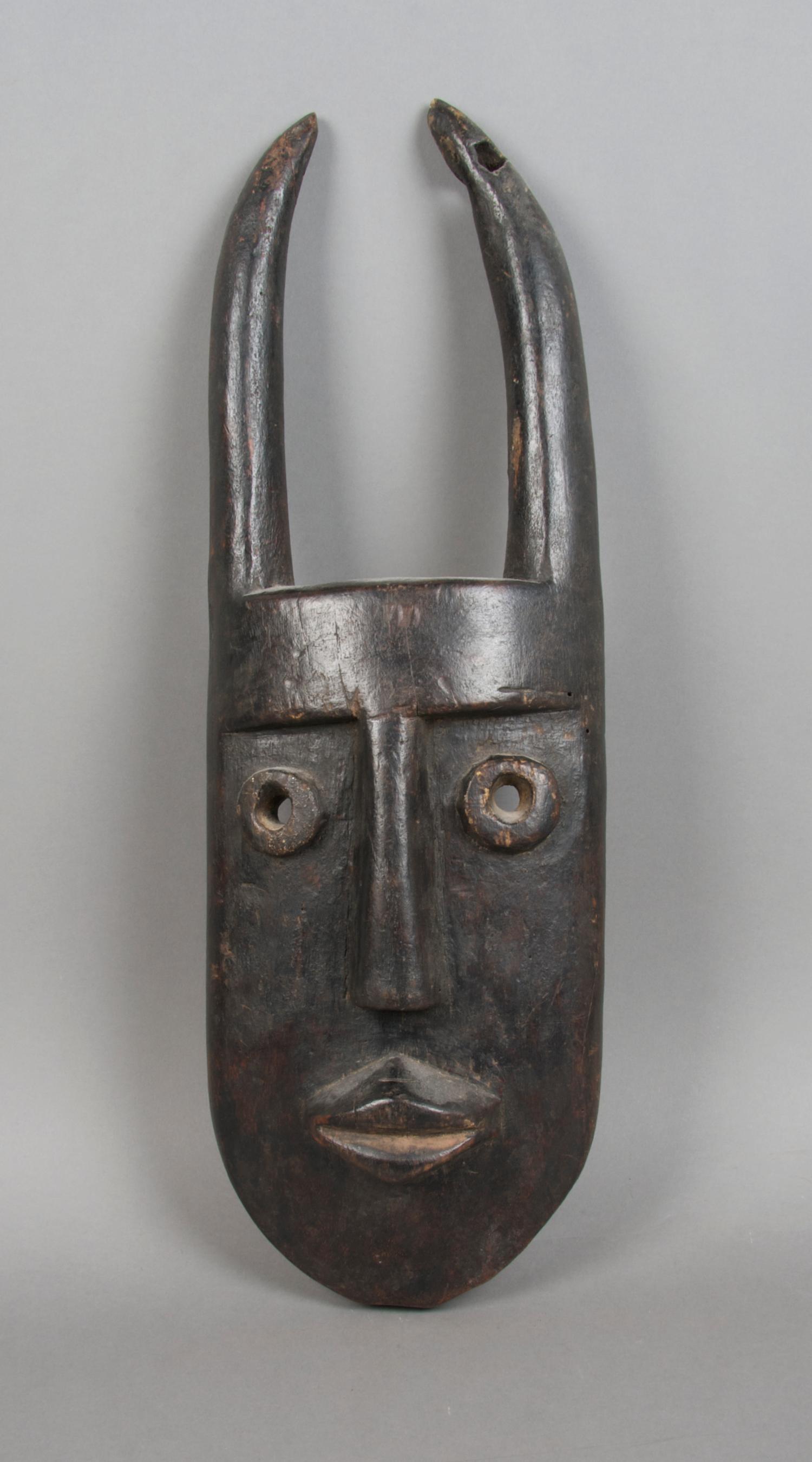 A Carved Wood Mask, Toma Height 20 inches.