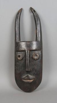 A Carved Wood Mask, Toma Height 20 inches.
