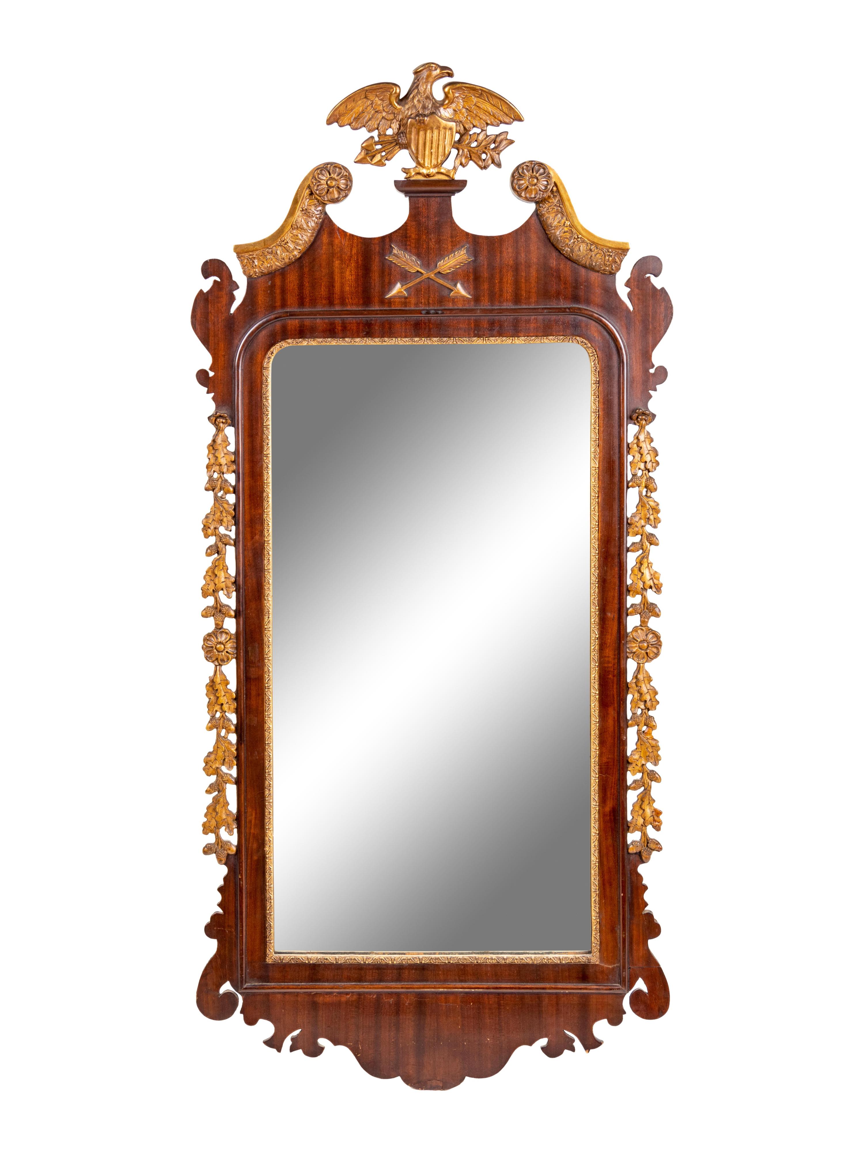 A Chippendale Style Parcel Gilt, Carved and Veneered Mahogany Looking Glass