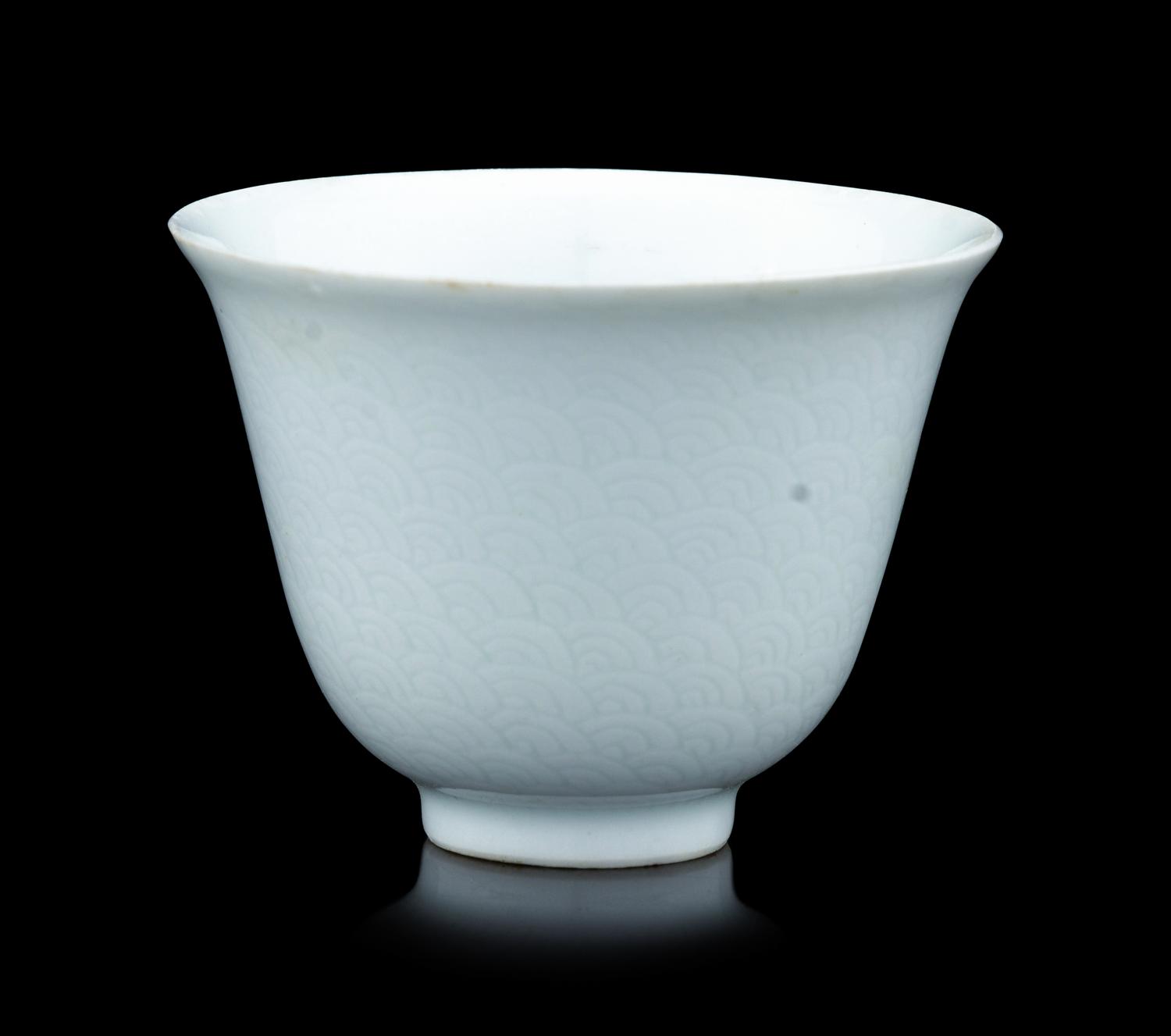 A Chinese Incised White Glazed Porcelain 'Waves' Cup