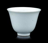 A Chinese Incised White Glazed Porcelain 'Waves' Cup