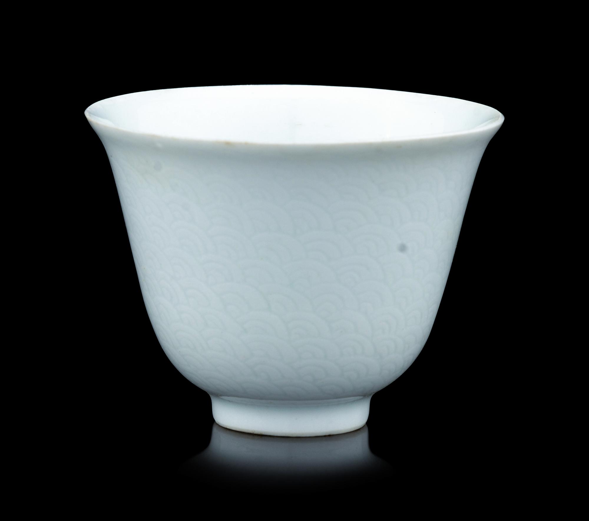A Chinese Incised White Glazed Porcelain 'Waves' Cup